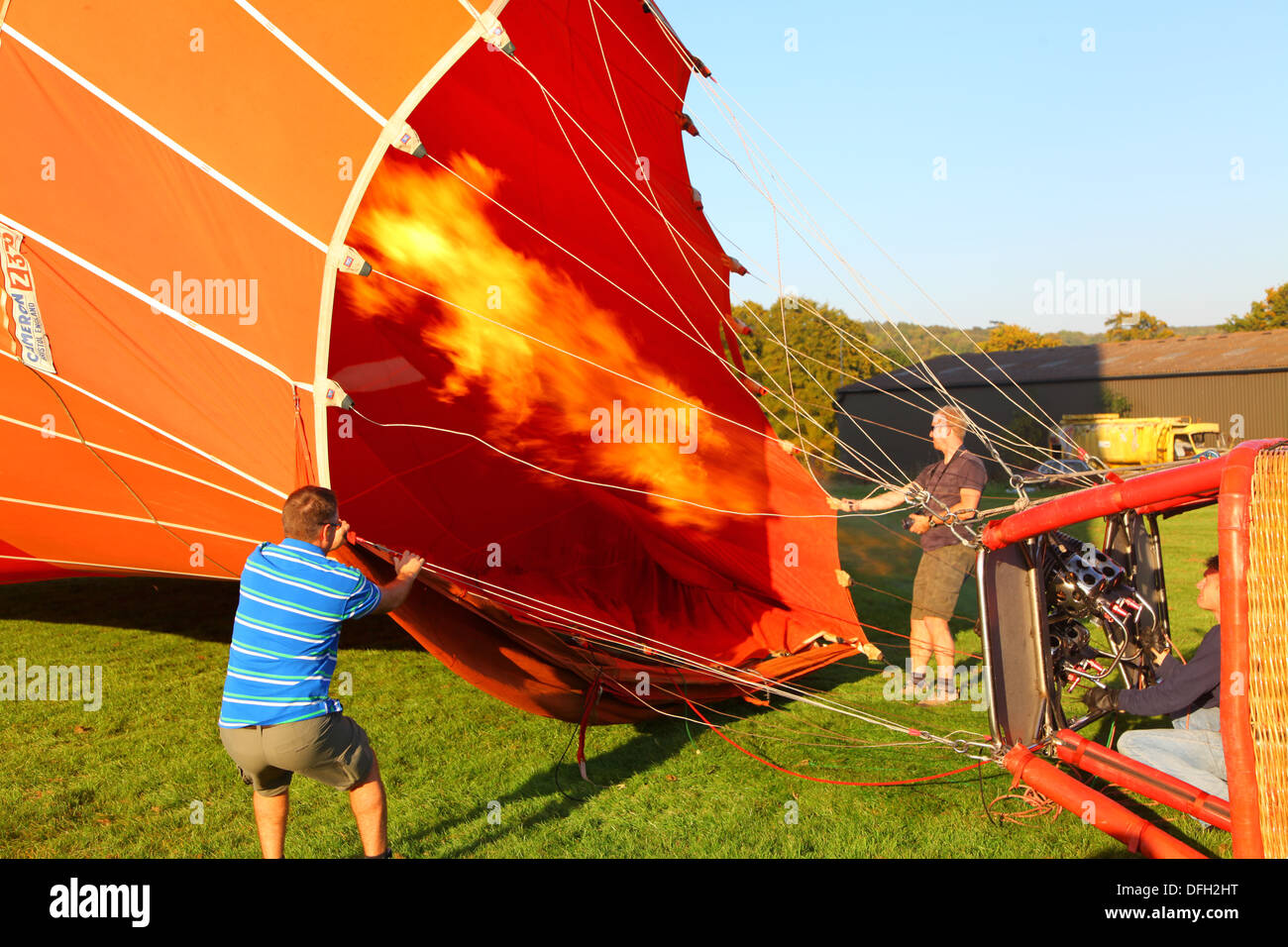 Inflating a hot air balloon on a Summer's day Stock Photo