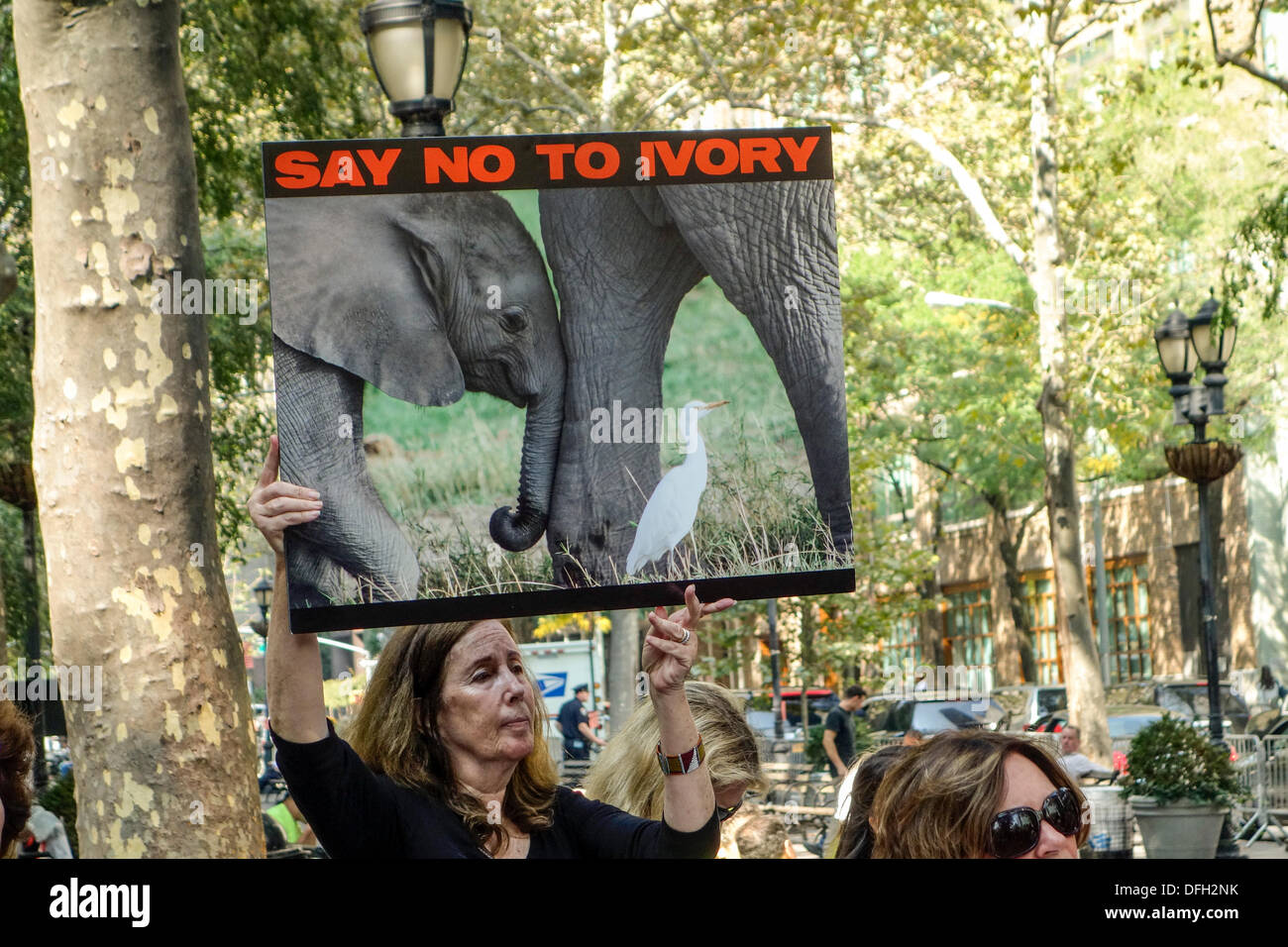 New York, NY, USA. 4th Oct. 2013. Supporters of iWorry march in a campaign to stop the killing of elephants for their ivory tusks. They head for the United Nations to present a letter calling for stricter penalties and a change in global policies regarding the killing of elephants and the sale of ivory. The David Sheldrick Wildlife Trust has organized the iWorry marches in 15 cities across the globe in the single largest demonstration of awareness for elephants. Credit:  Paulette Sinclair/Alamy Live News Stock Photo