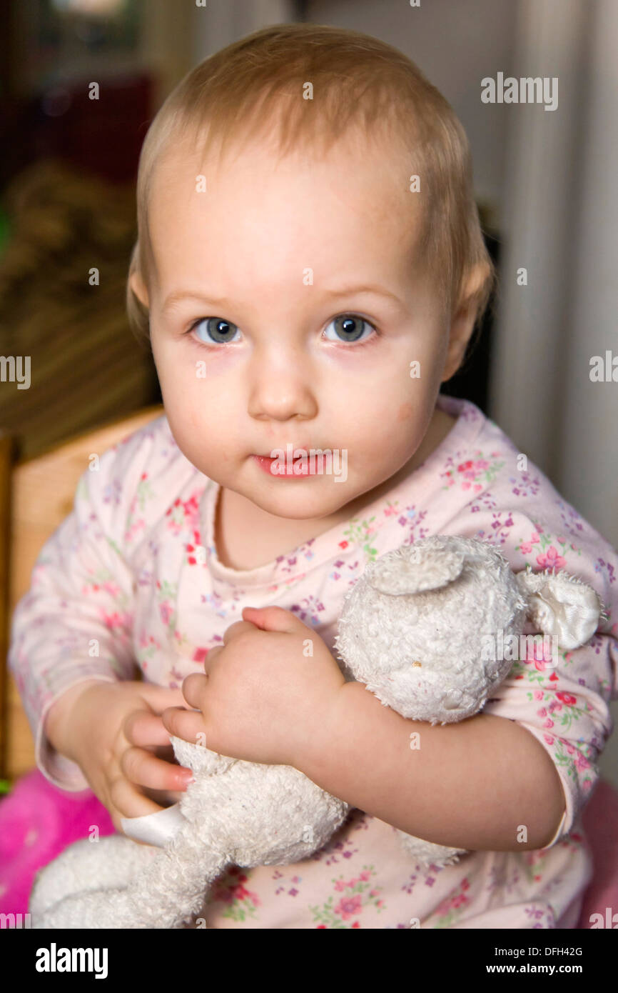 1 year old girl with cuddly toy Stock Photo Alamy