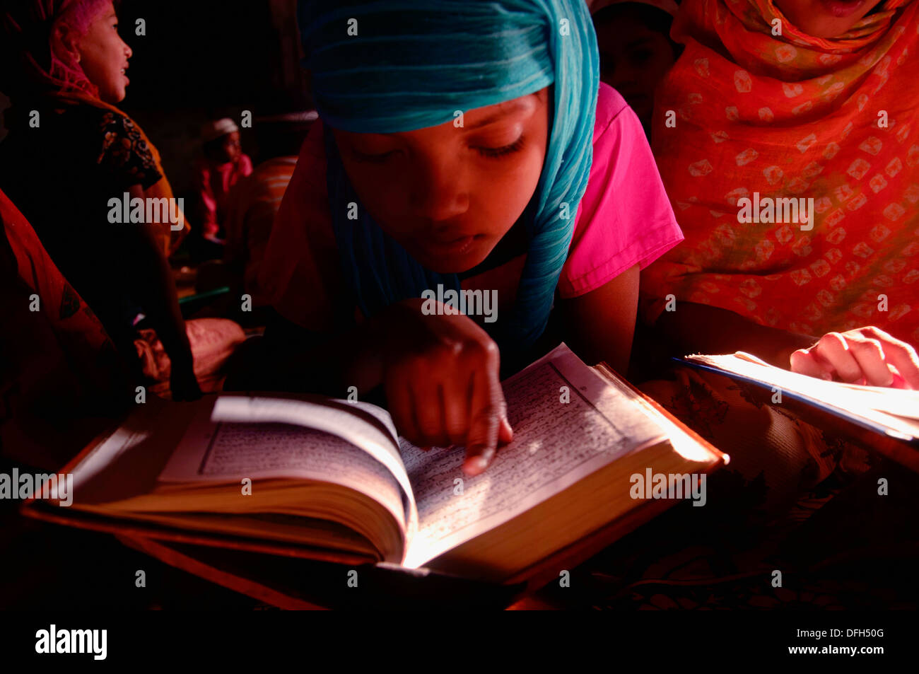 Girl reciting The Holy Quran Stock Photo Alamy