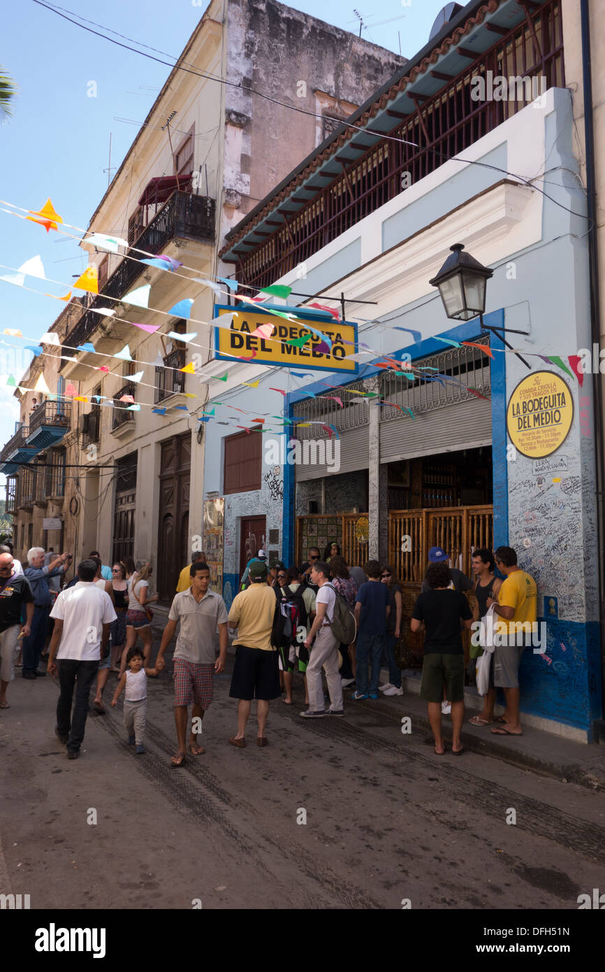 Locals and Tourists mingle outside the famous La Bodeguita del Medio restaurant in Havana, Cuba Stock Photo