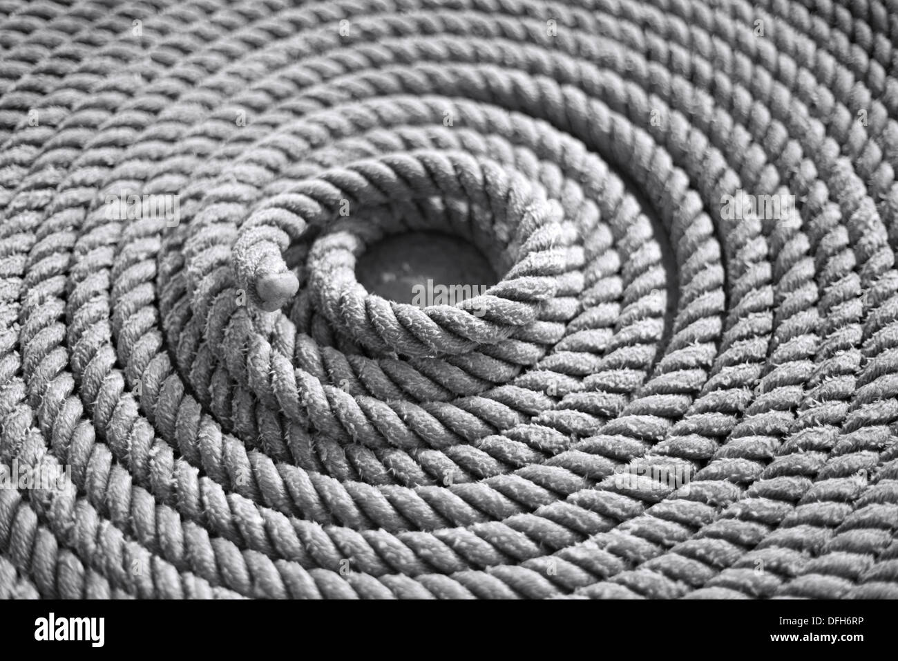 Coiled rope on bow of boat St Mary's Isles of Scilly, Cornwall. Stock Photo