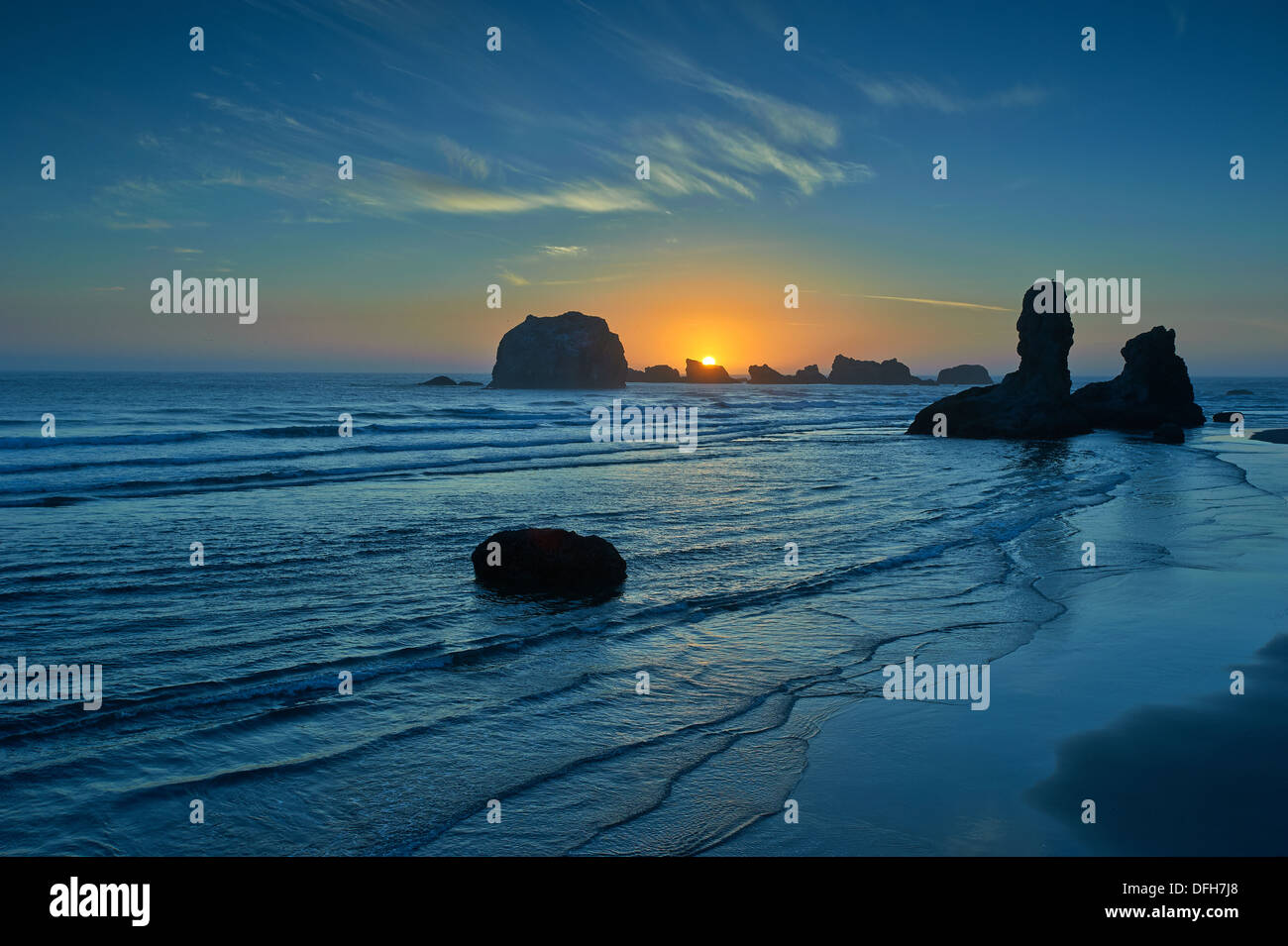 Rocks on the Bandon shore at dusk Stock Photo - Alamy