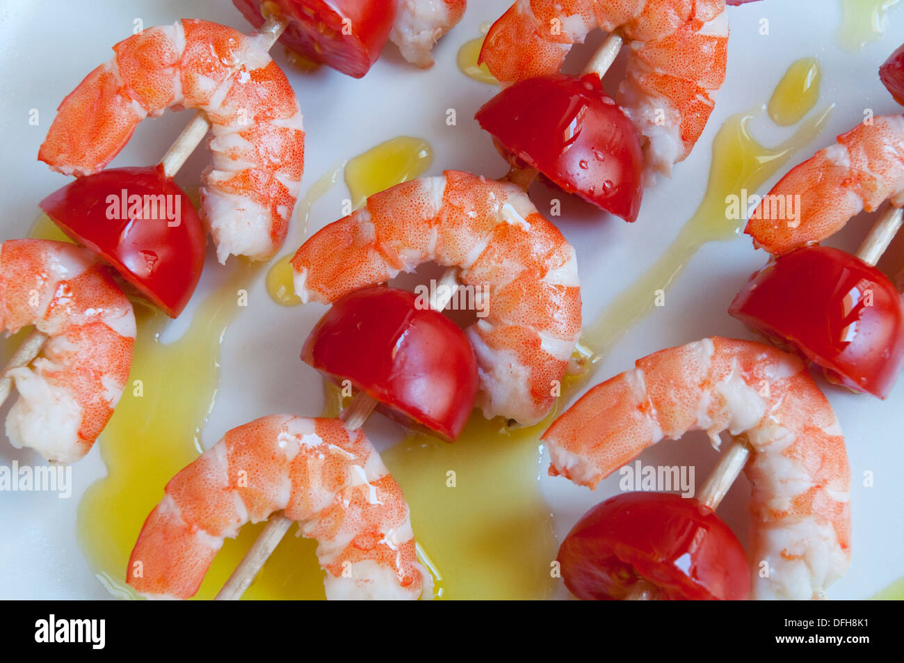 Brochettes of prawns and tomato with olive oil. Spain Stock Photo Alamy