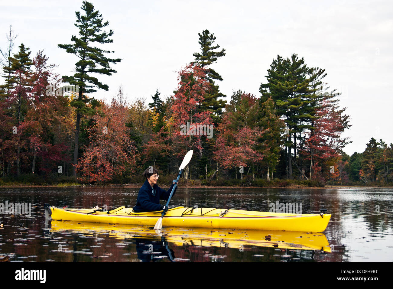 Kayaking on Scott Pond in Fitzwilliam, New Hampshire amidst the autumn