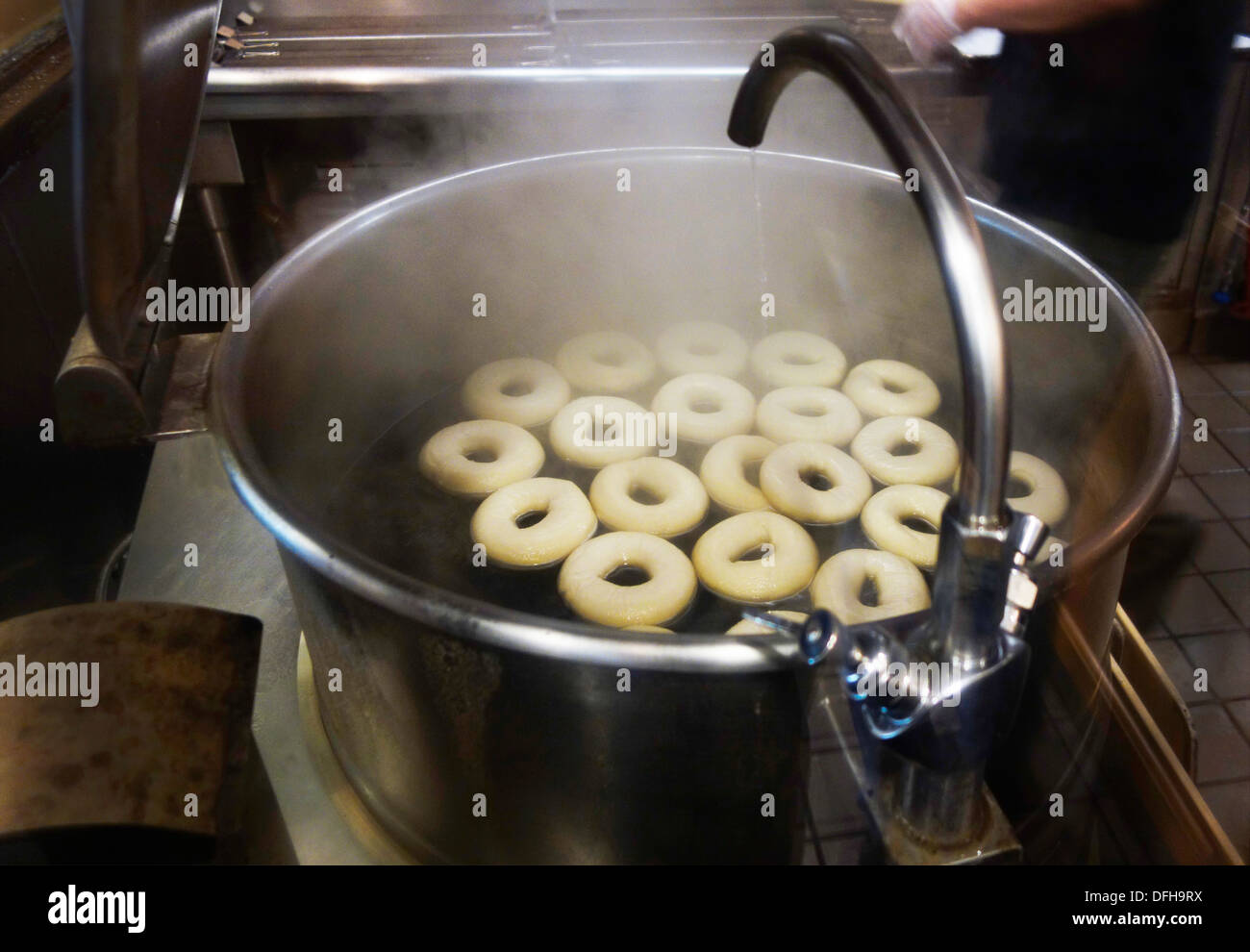 boiling bagels in large pot Stock Photo - Alamy