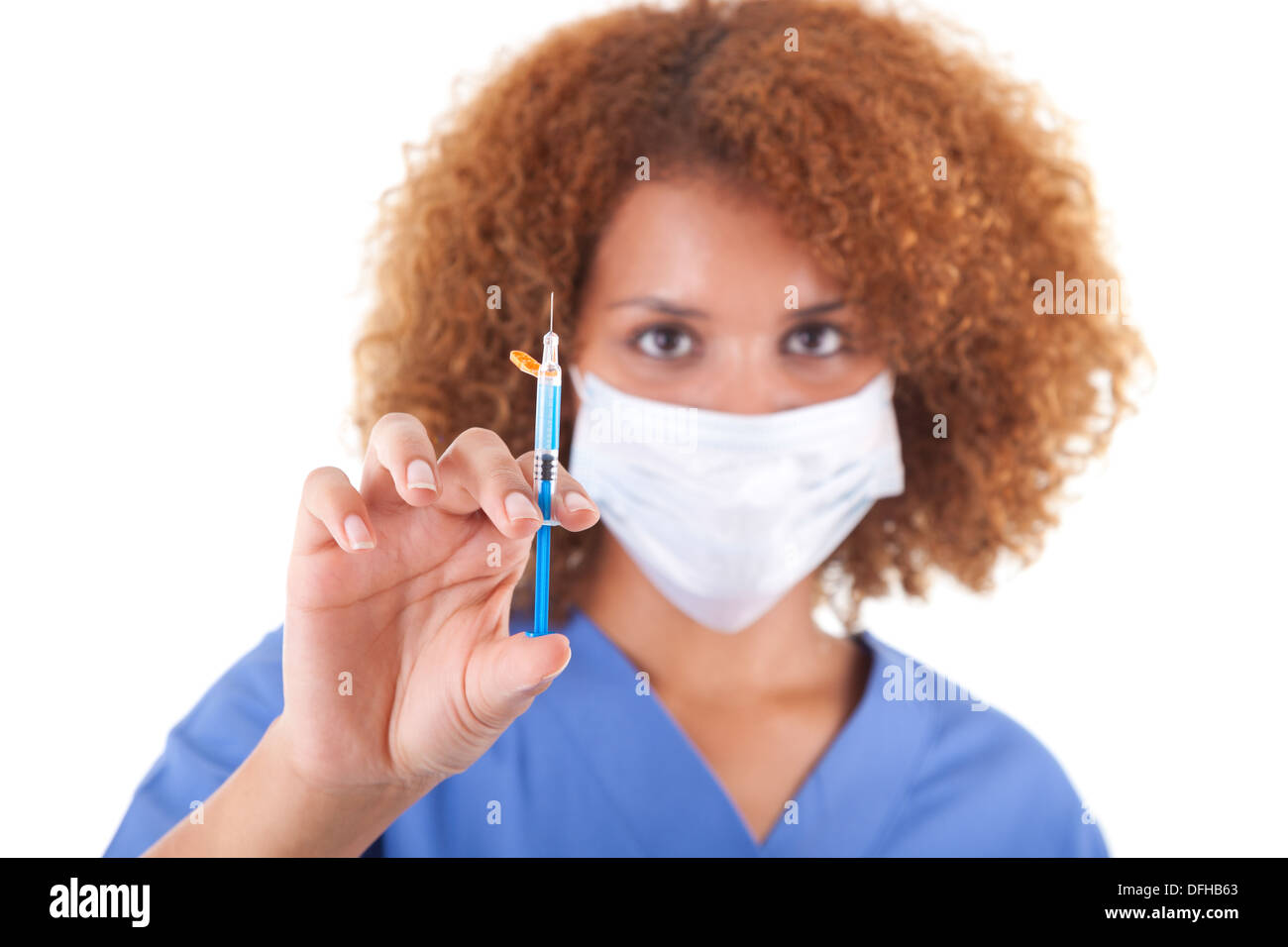 African American nurse holding a needle, isolated on white background - Black people Stock Photo