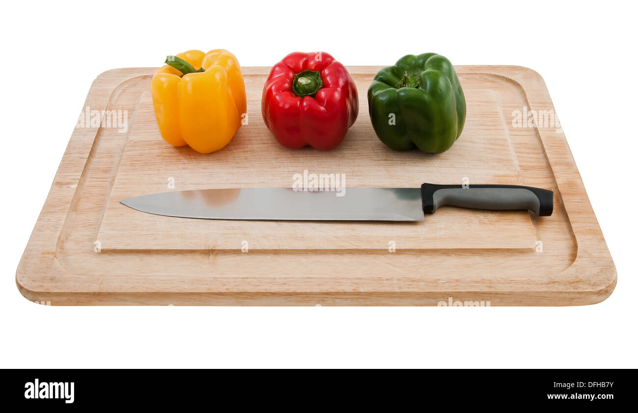 Bell peppers ready for slicing on board Stock Photo - Alamy