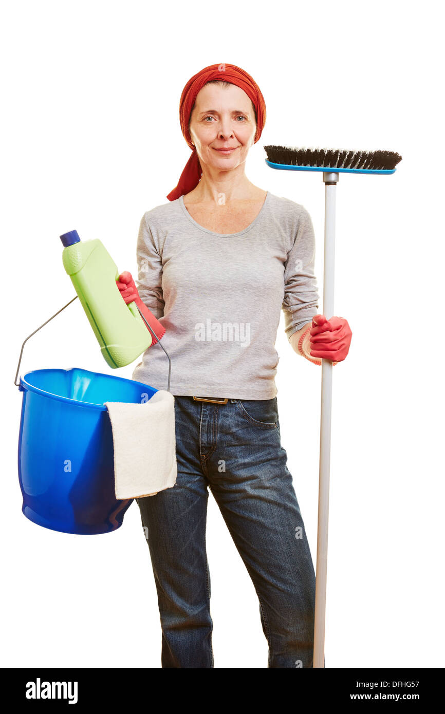 Happy elderly housewife with different cleaning products Stock Photo