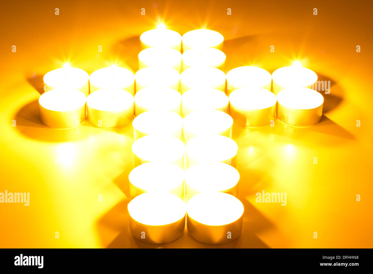 Cross of lighted candles Stock Photo Alamy