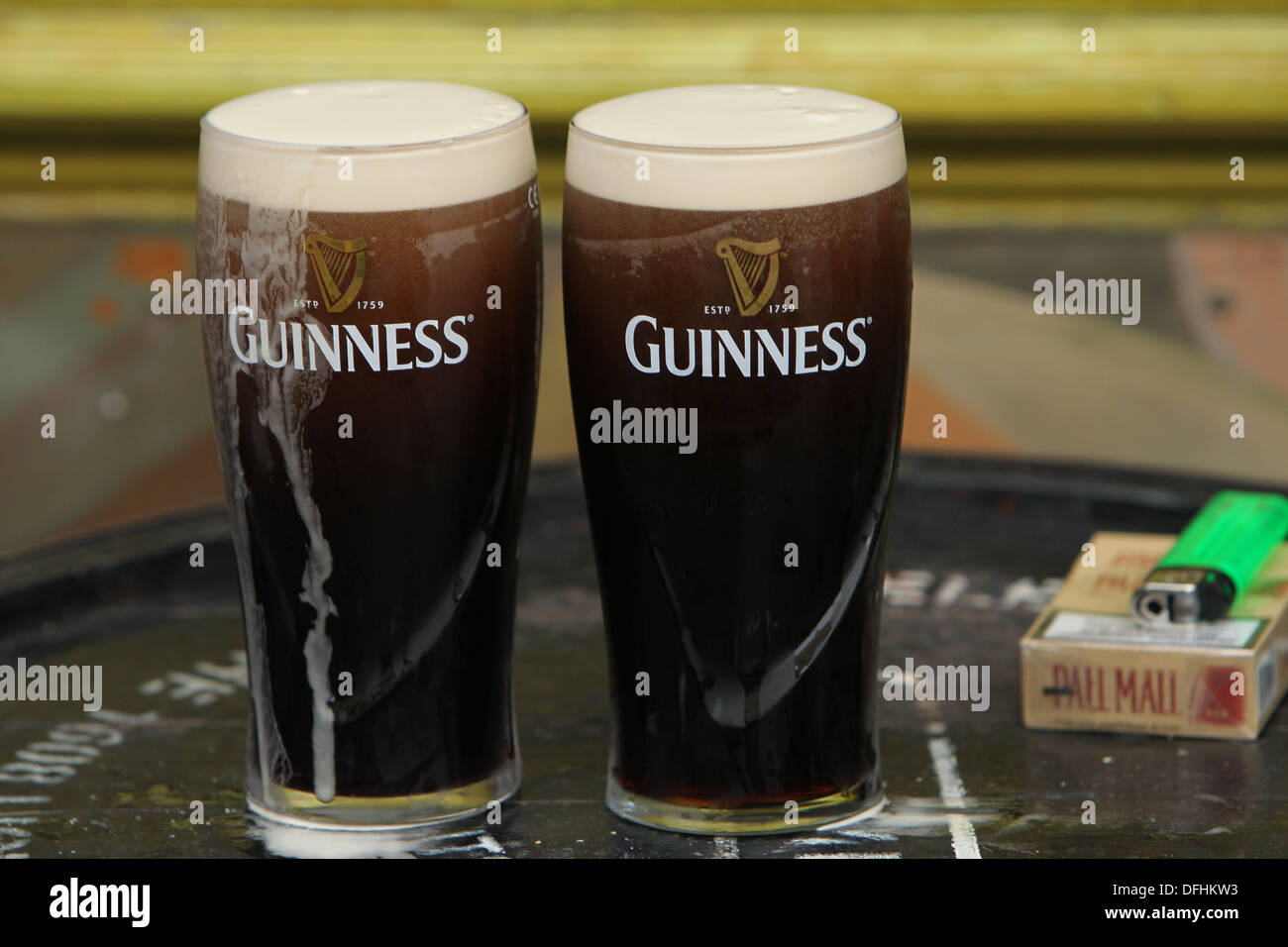 Image of two pint glasses of Guinness outside a Dublin pub on Arthur's Day 2013 Stock Photo