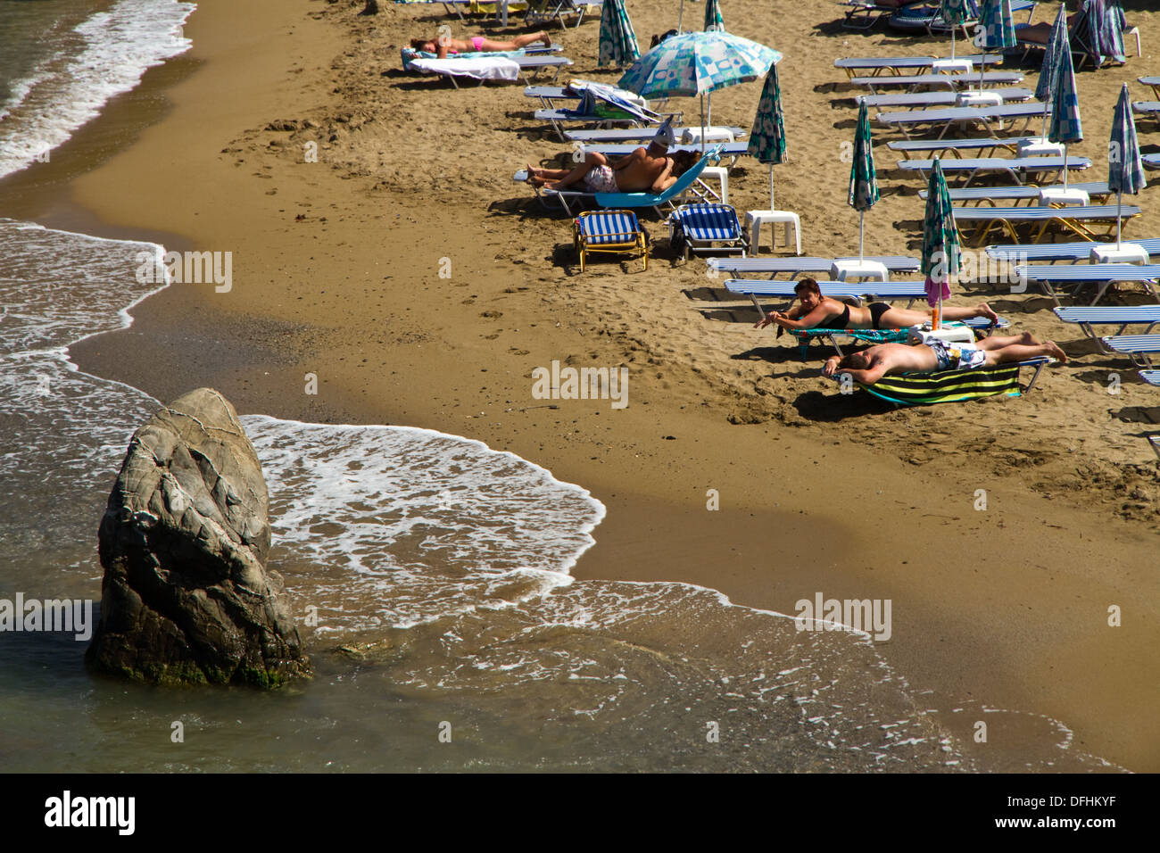 Sunbathing at Panormos Beach, Crete, Greece Stock Photo