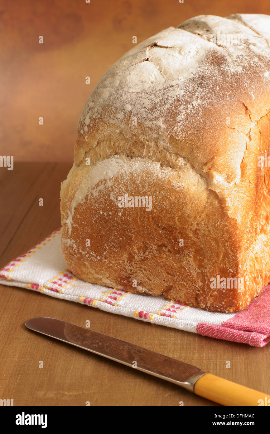 Traditional style unsliced white loaf of bread Stock Photo Alamy