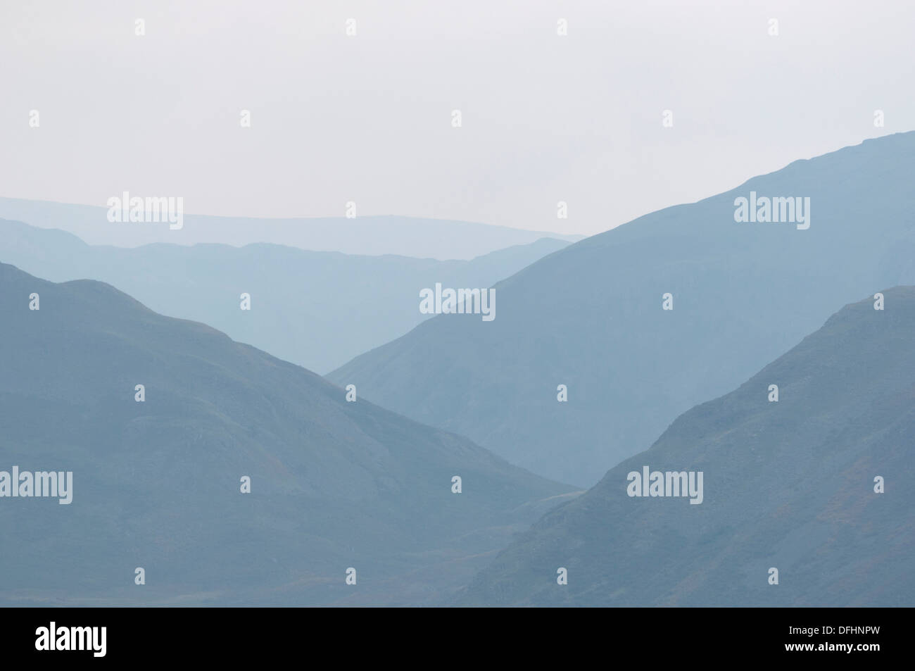 Outline silhouette of Lake District Mountains and fells in the mist Stock Photo