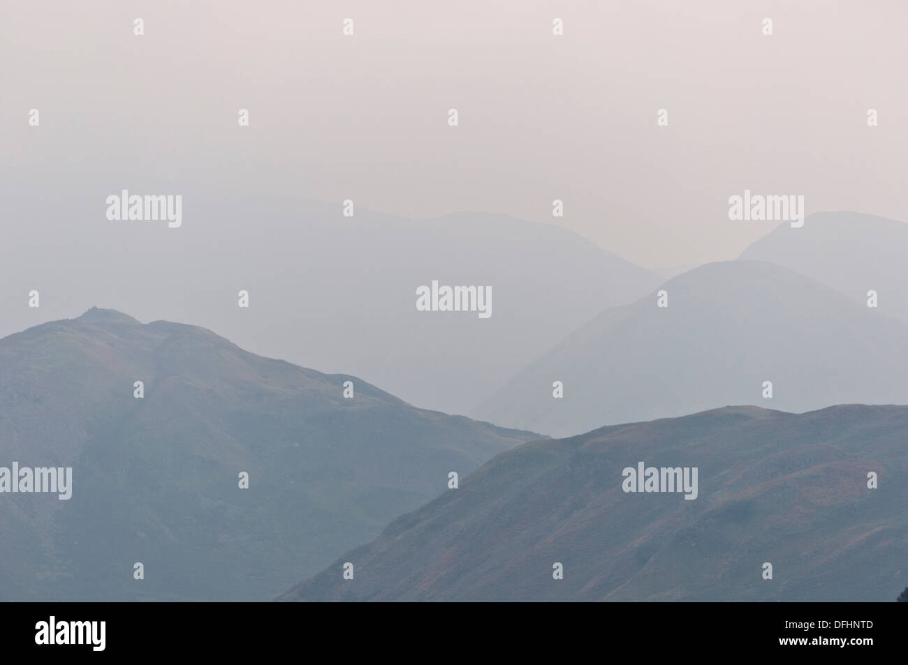 Outline silhouette of Lake District Mountains and fells in the mist Stock Photo