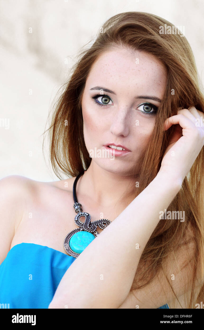 Beautiful romantic teenage girl outdoors in blue dress Stock Photo