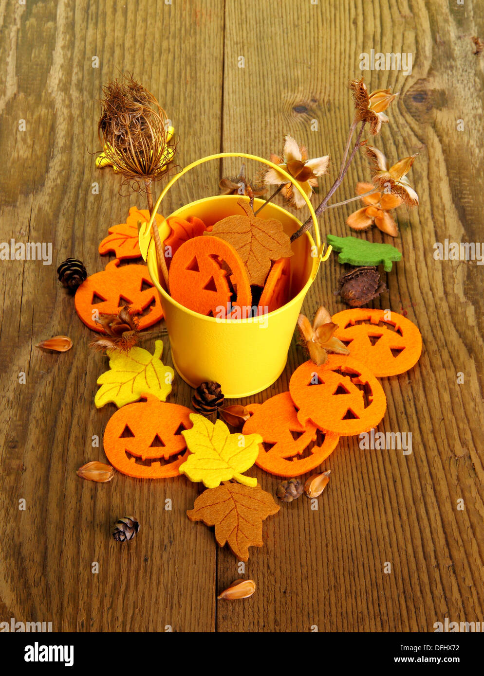 Yellow bucket with Halloween decoration, vertical Stock Photo - Alamy