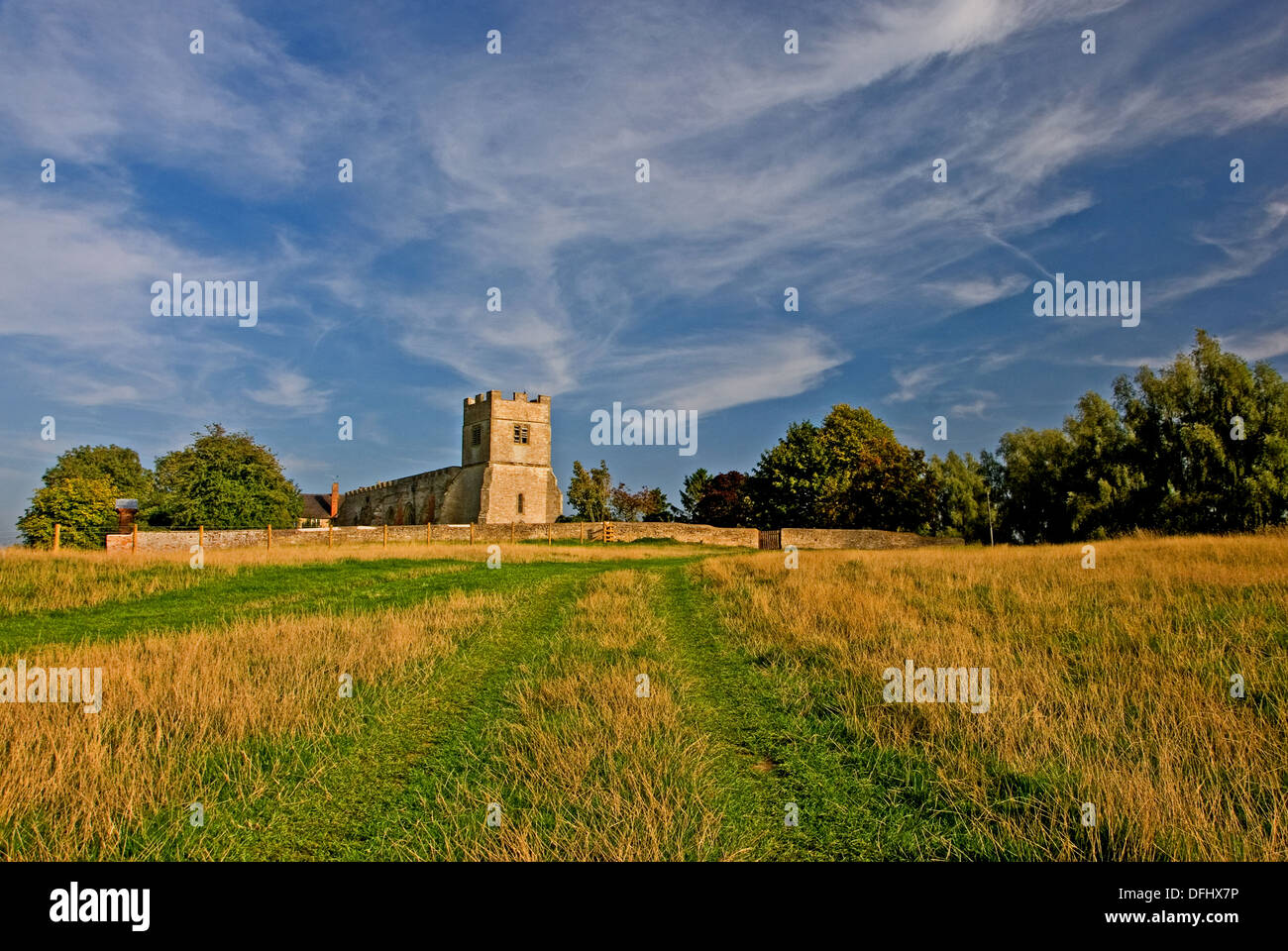 The stone medieval church in the small Warwickshire village of Chesterton, sits on a small hillock on the edge of the village Stock Photo