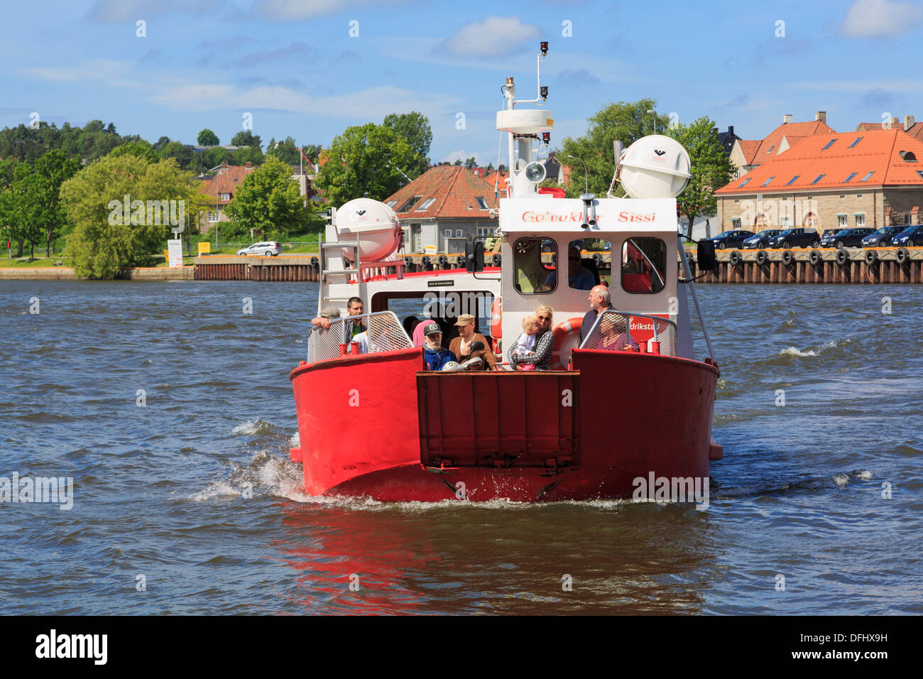 Passengers using the free ferry service across River Glomma from the new town to the old Gamlebyen, Fredrikstad, Ostfold, Norway Stock Photo