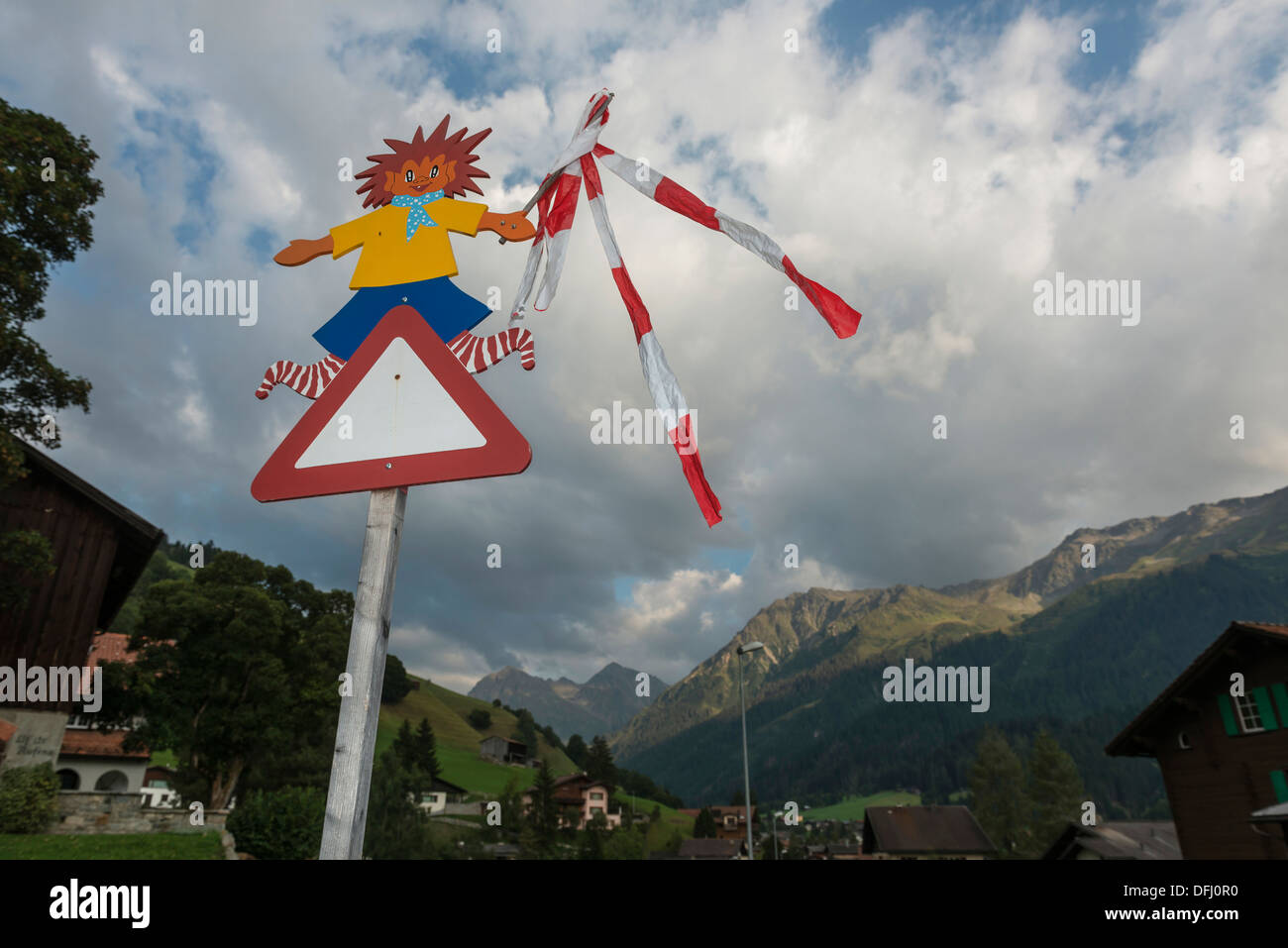 School children triangular warning road signpost. Klosters, Switzerland Stock Photo