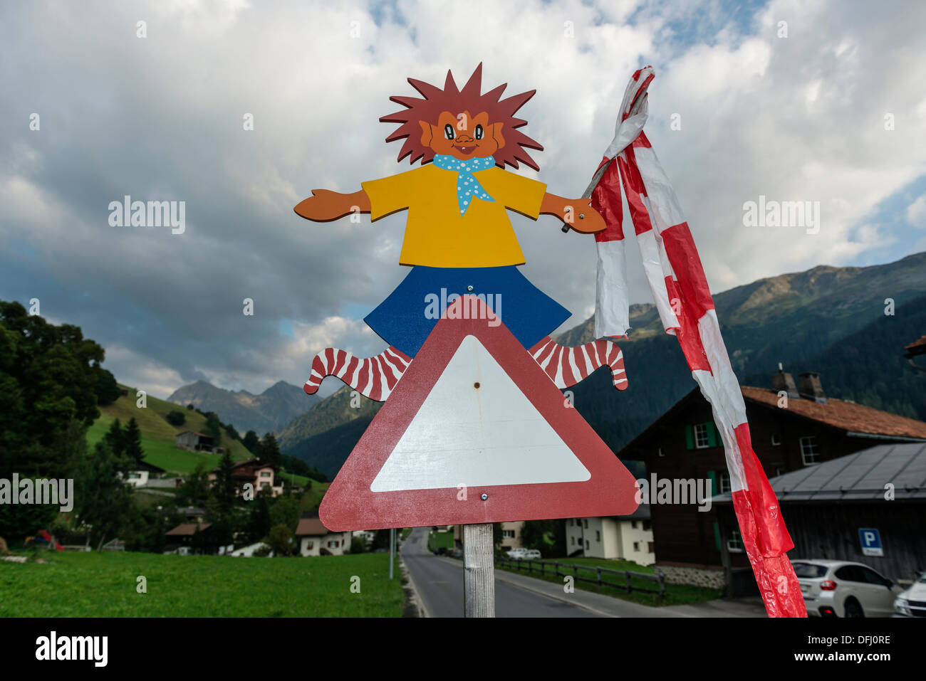 School children triangular warning road signpost. Klosters, Switzerland Stock Photo