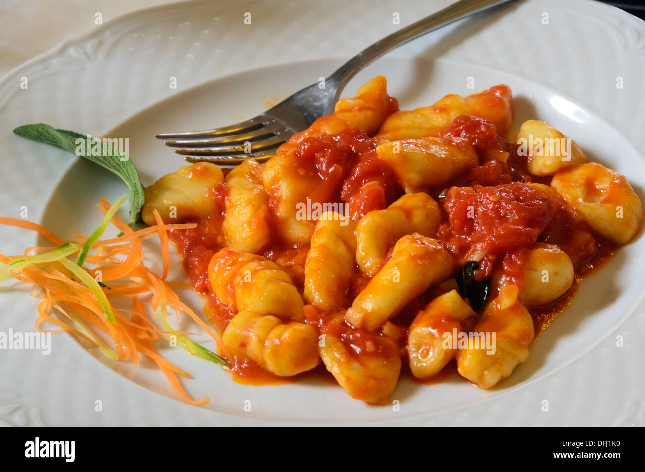 A plate of freshly made gnocchi at a restaurant in Tuscany, Italy. Stock Photo