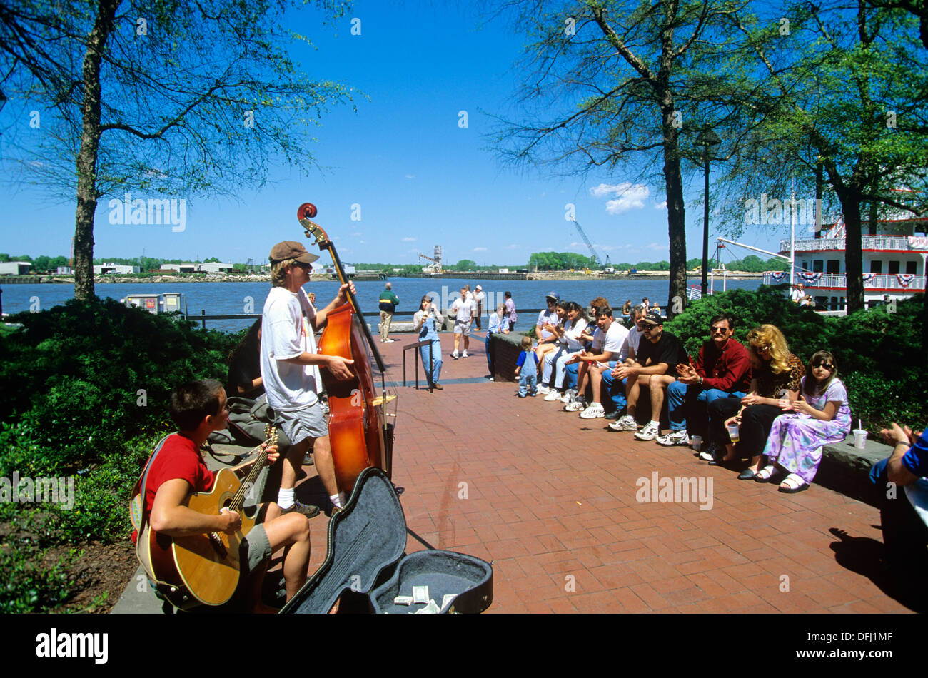Street musicians performing on Savannah's River Street on the city's waterfront, Georgia, USA Stock Photo