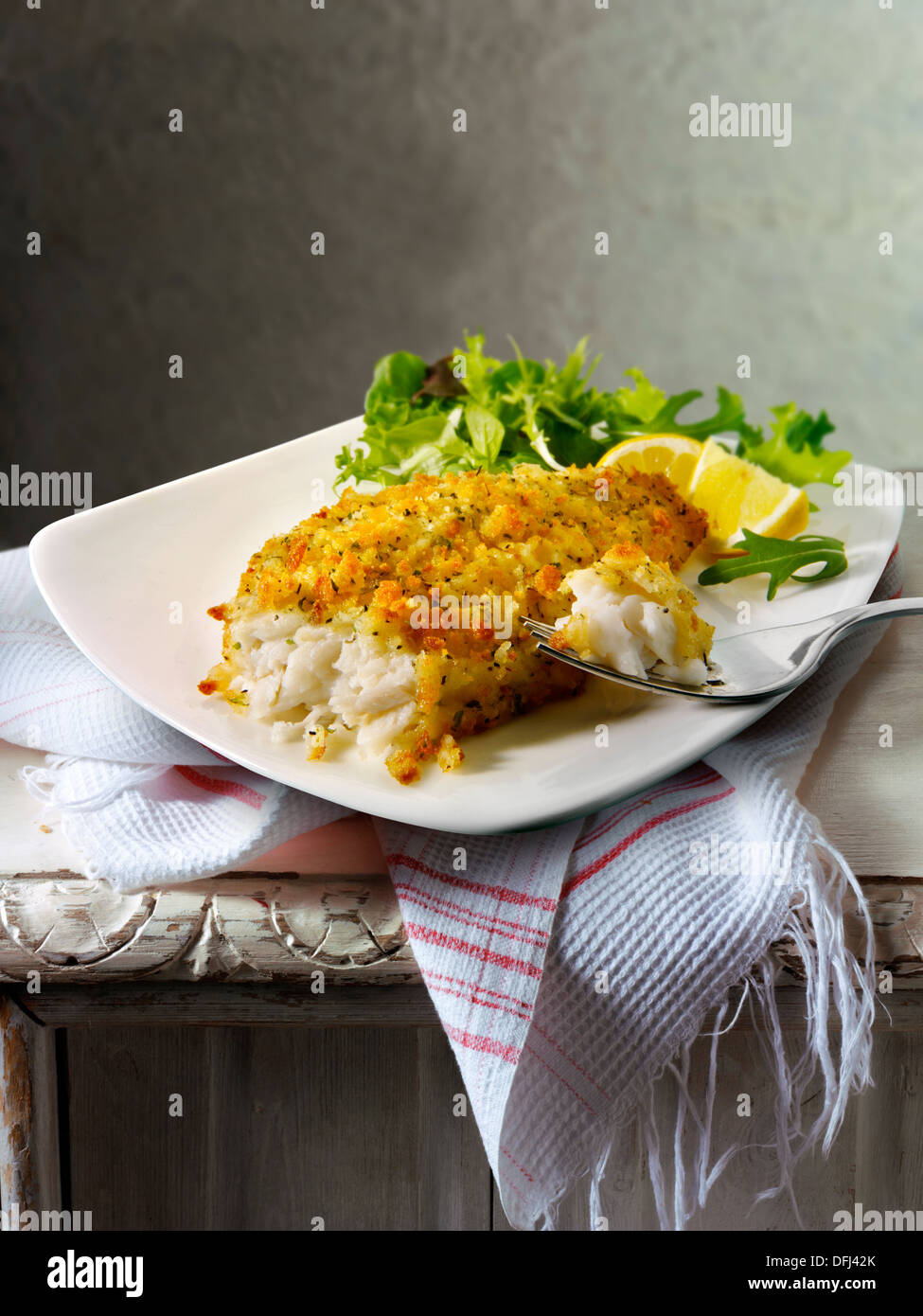 Lightly battered sole & Salad food served on a plate on a table Stock Photo