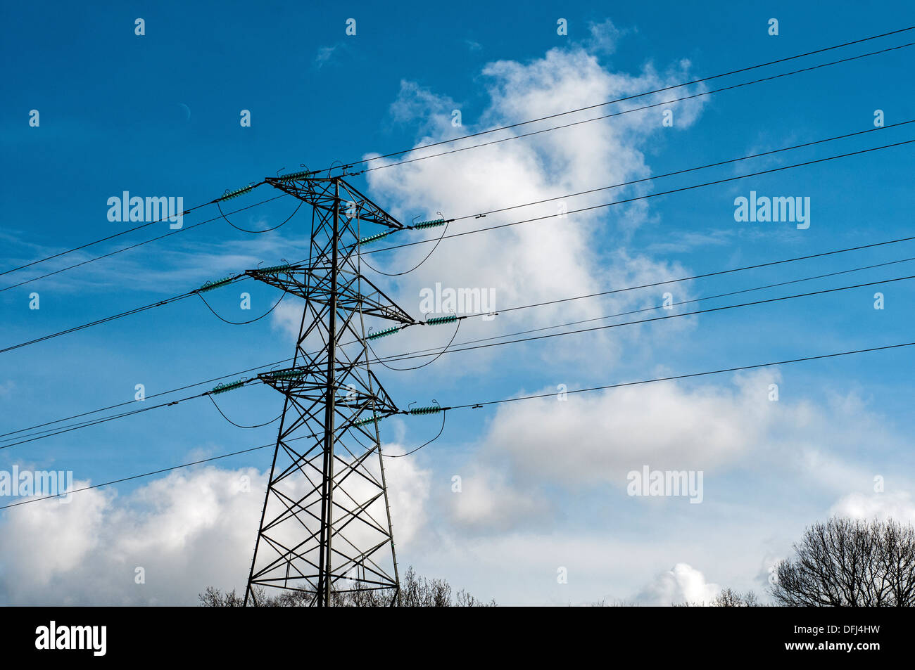 Electricity Transmission Power Lines and Tower crossing the countryside Stock Photo
