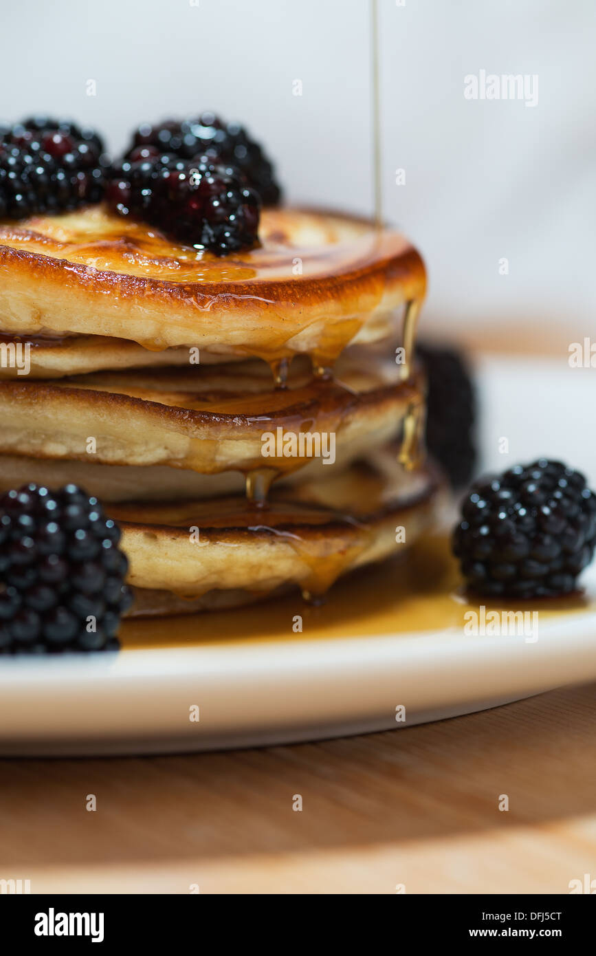 American style pancakes with maple syrup and blackberries Stock Photo