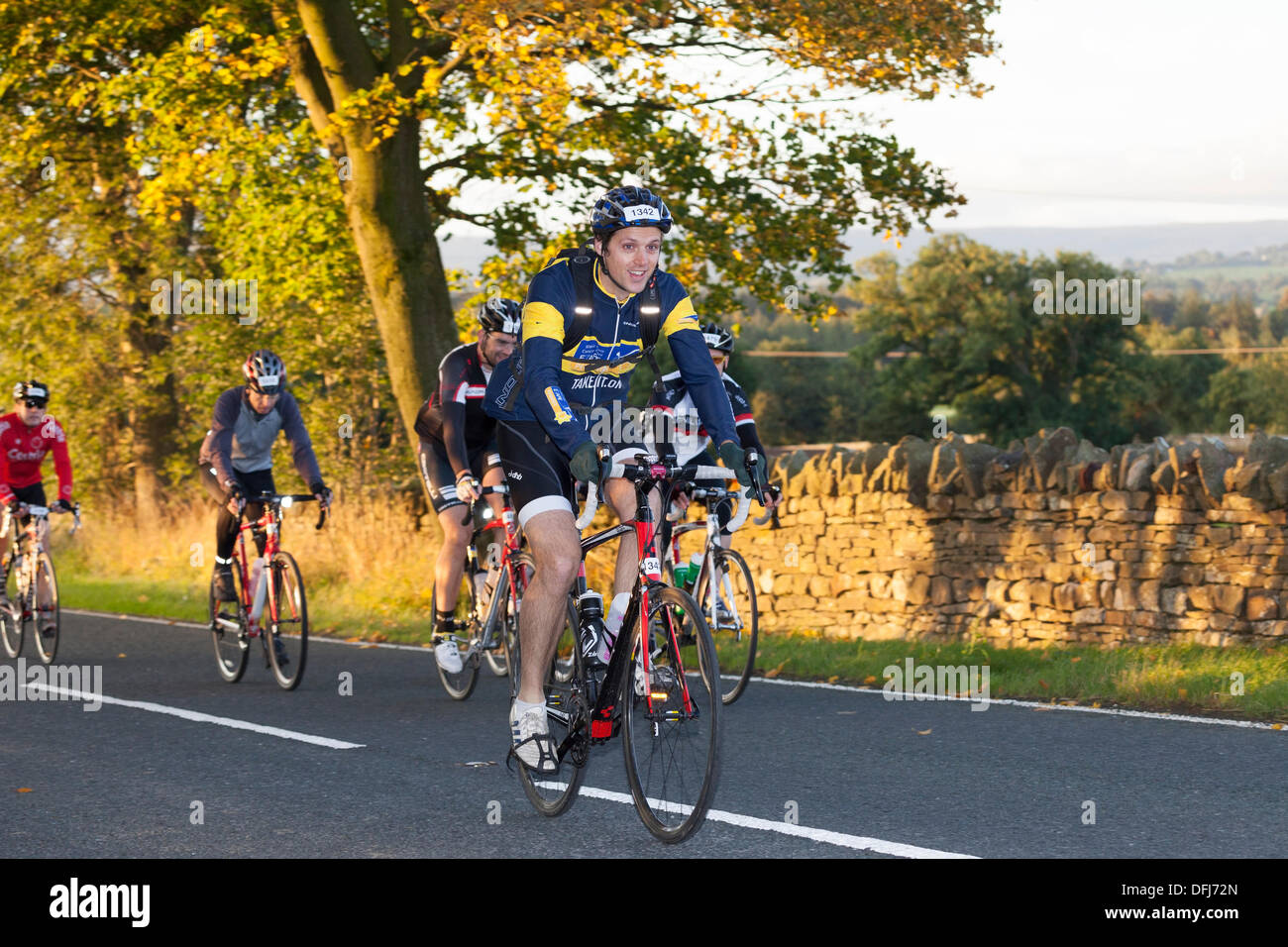Marwood, County Durham, UK . 06th Oct, 2013.  Competitors on the first hill of the Marie Curie Cancer Care Etape Pennines 2013 Cycle Event. The cyclists started the race at first light and will cover 84 miles and 8,532 feet of ascent. Credit:  David Forster/Alamy Live News Stock Photo
