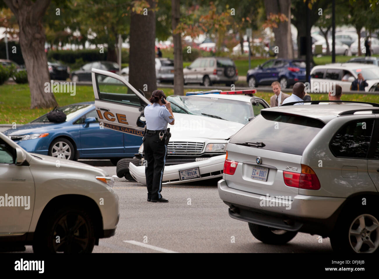 Policewoman at a police cruiser accident scene - Washington, DC USA Stock Photo