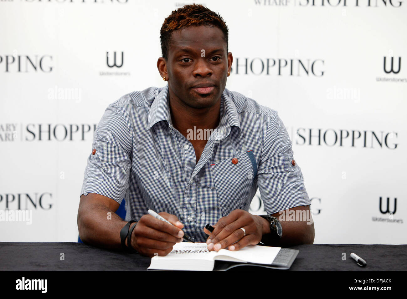 Louis Saha Tottenham Hotspur's footballer holds a copy of his new autobiography, Thinking Inside the Box: Reflections on Life as Stock Photo