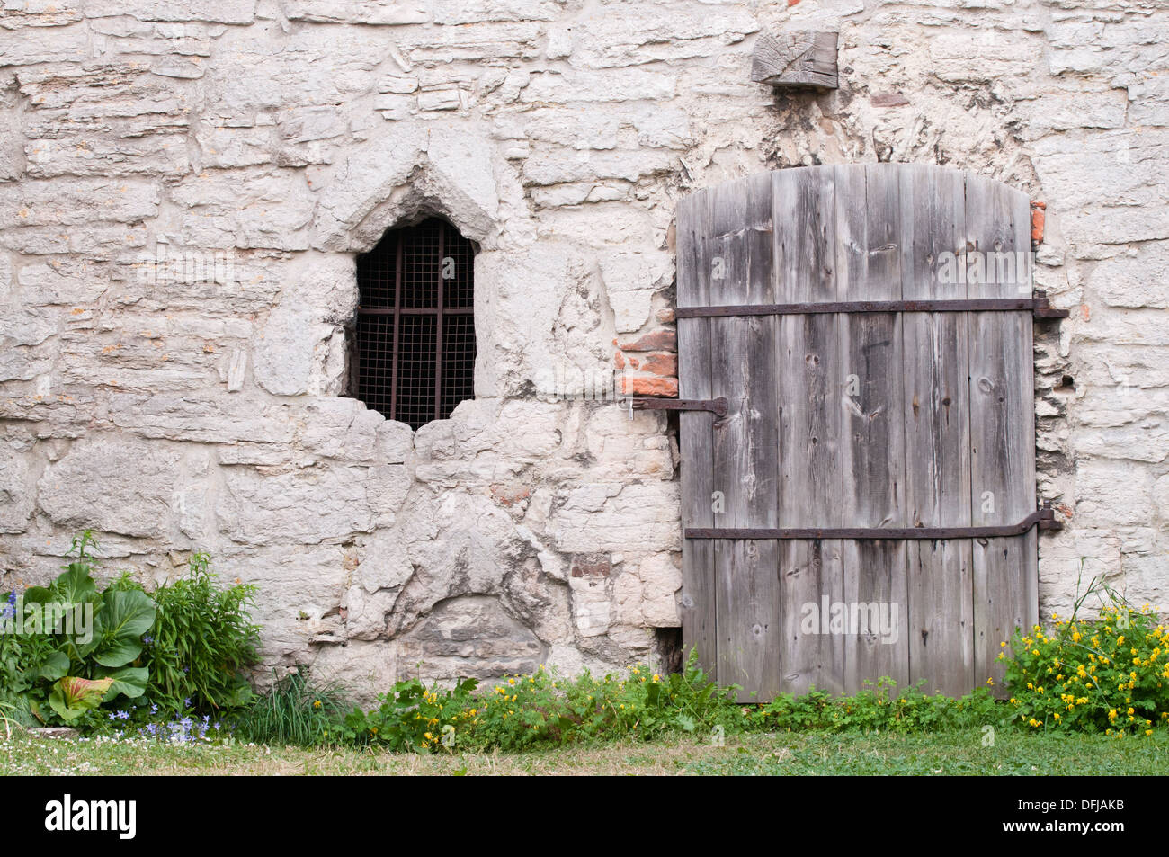 Stone wall with window and door Stock Photo - Alamy