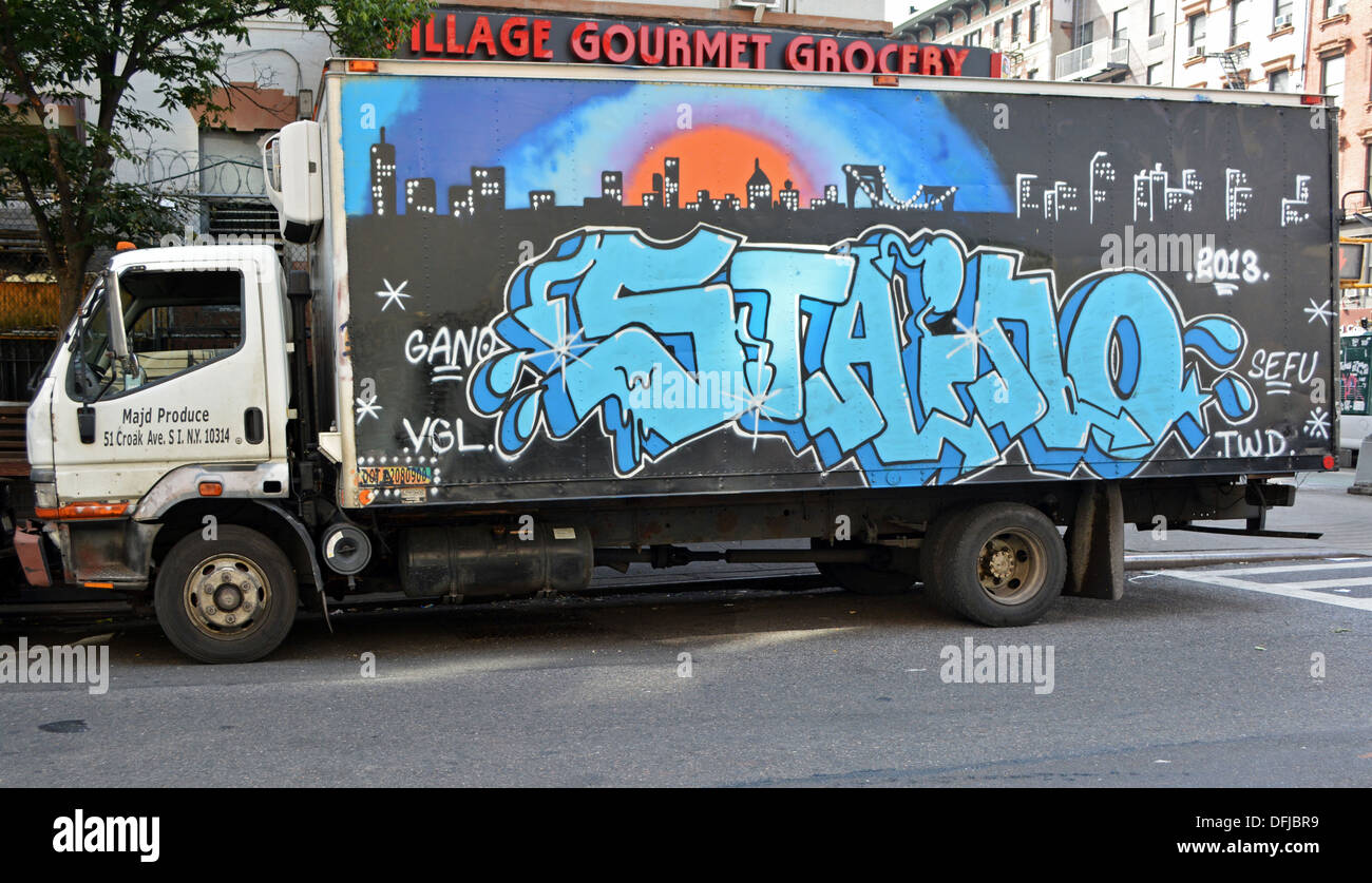 A truck with painted graffiti parked off Second avenue in the East Village, New York City Stock Photo