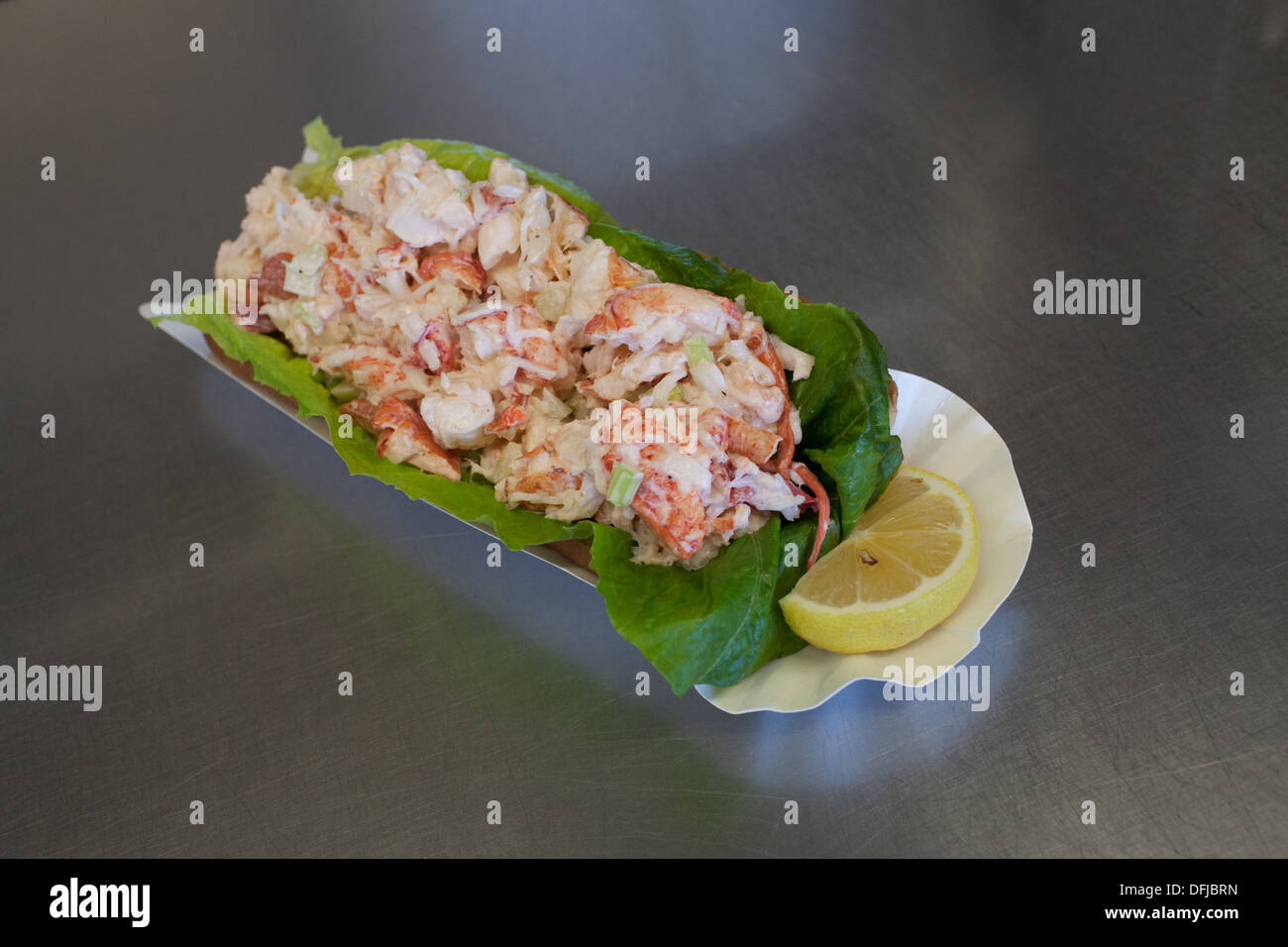 A lobster roll sitting on the counter at Captain Scott's Lobster Dock