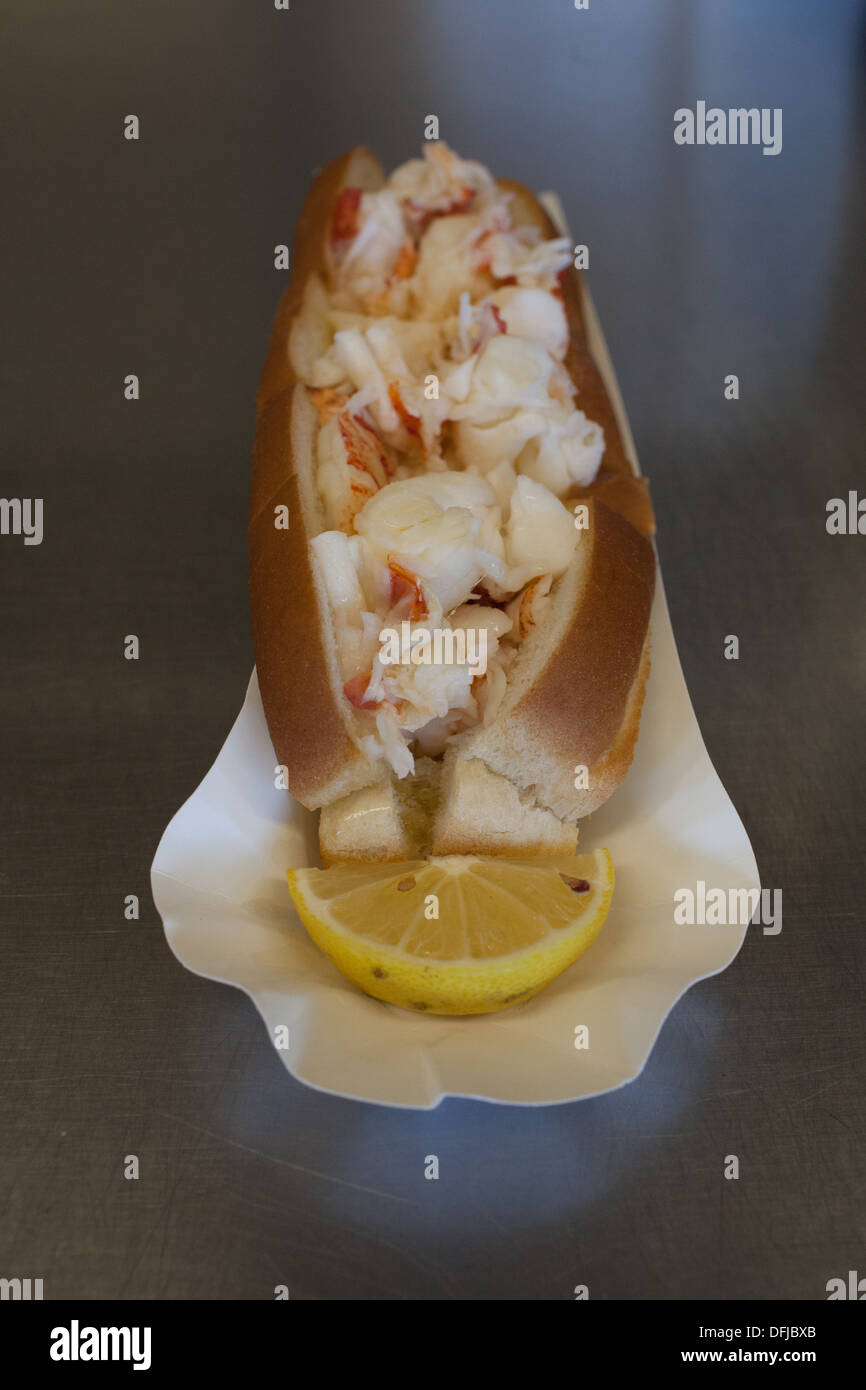 A lobster roll sitting on the counter at Captain Scott's Lobster Dock