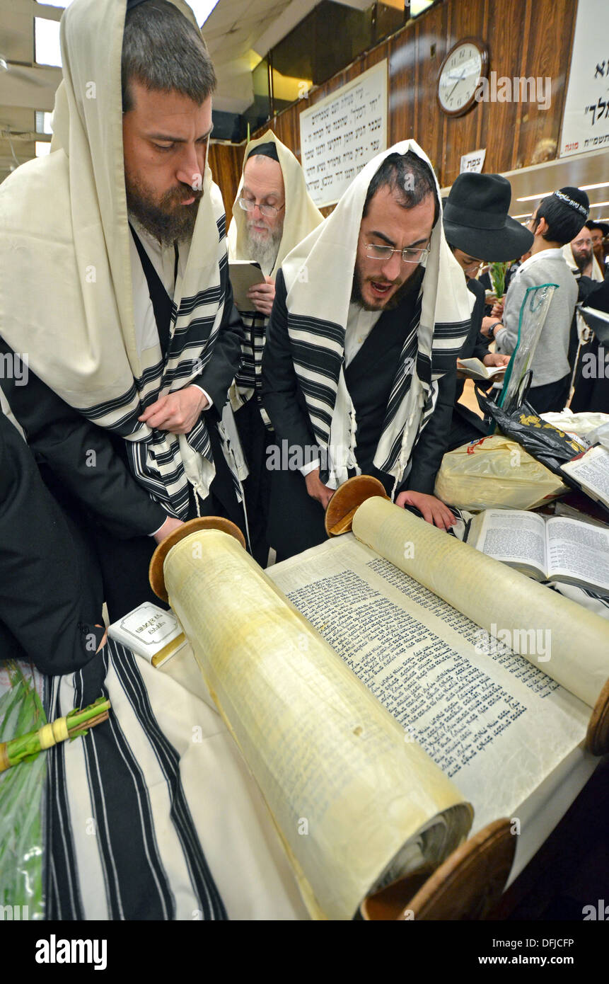Reading from a Torah scroll at Sukkot morning services at Lubavitch headquarters in Brooklyn, New York. Stock Photo