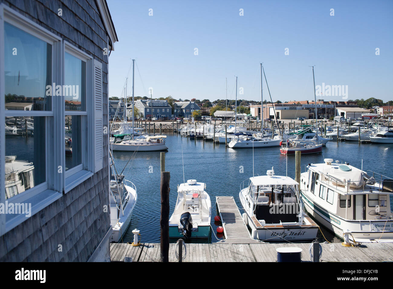 Boats docked outside Captain's Scott's Lobster Dock on Shaw's Cove in New London Connecticut Stock Photo