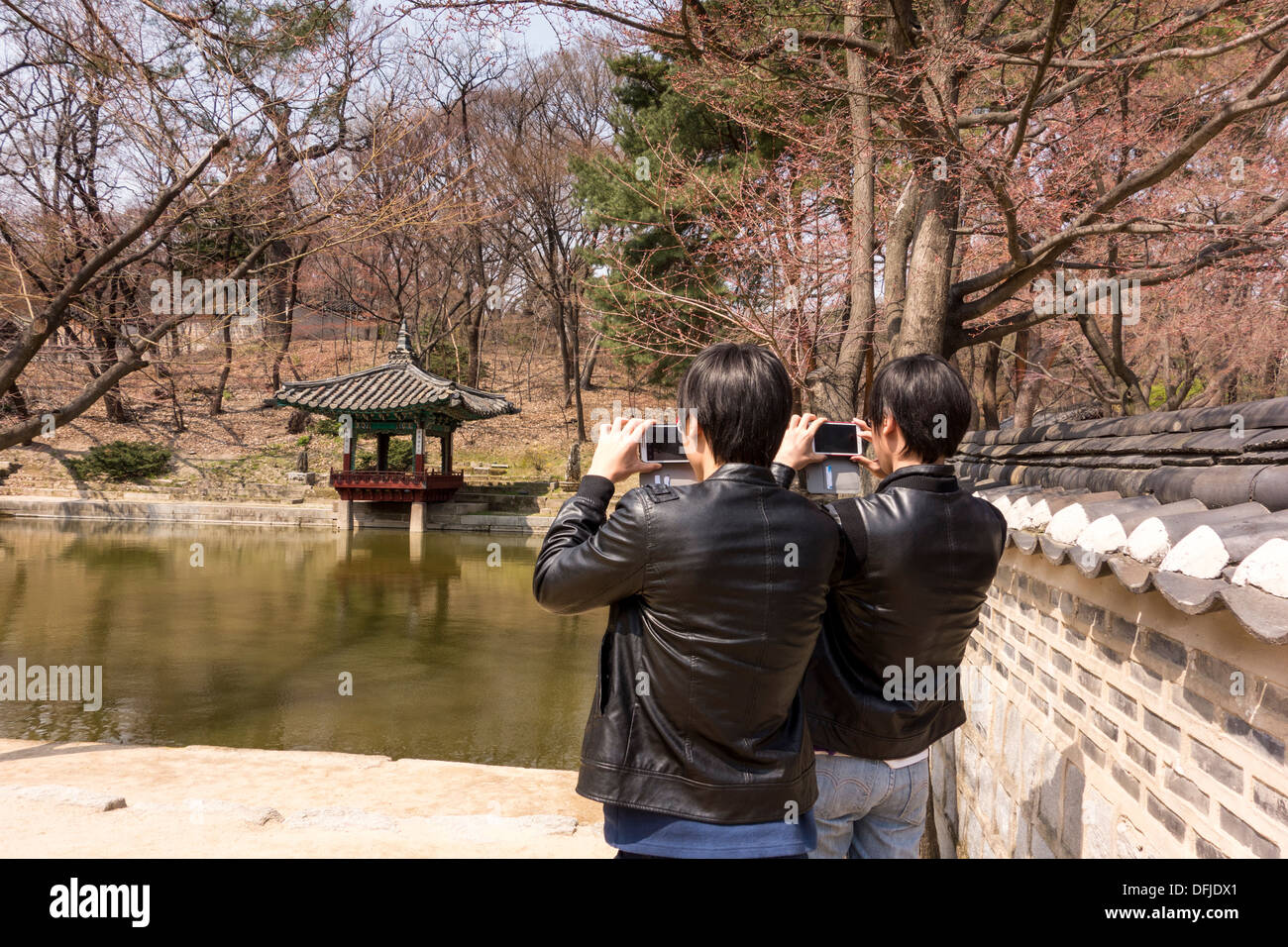 Twin brothers taking photos in Changdeokgung Palace, Seoul, Korea Stock Photo