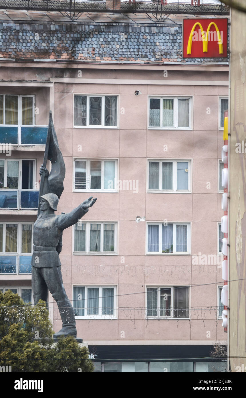 Targu Mures, Romania, Communist statue and a McDonald's sign Stock Photo