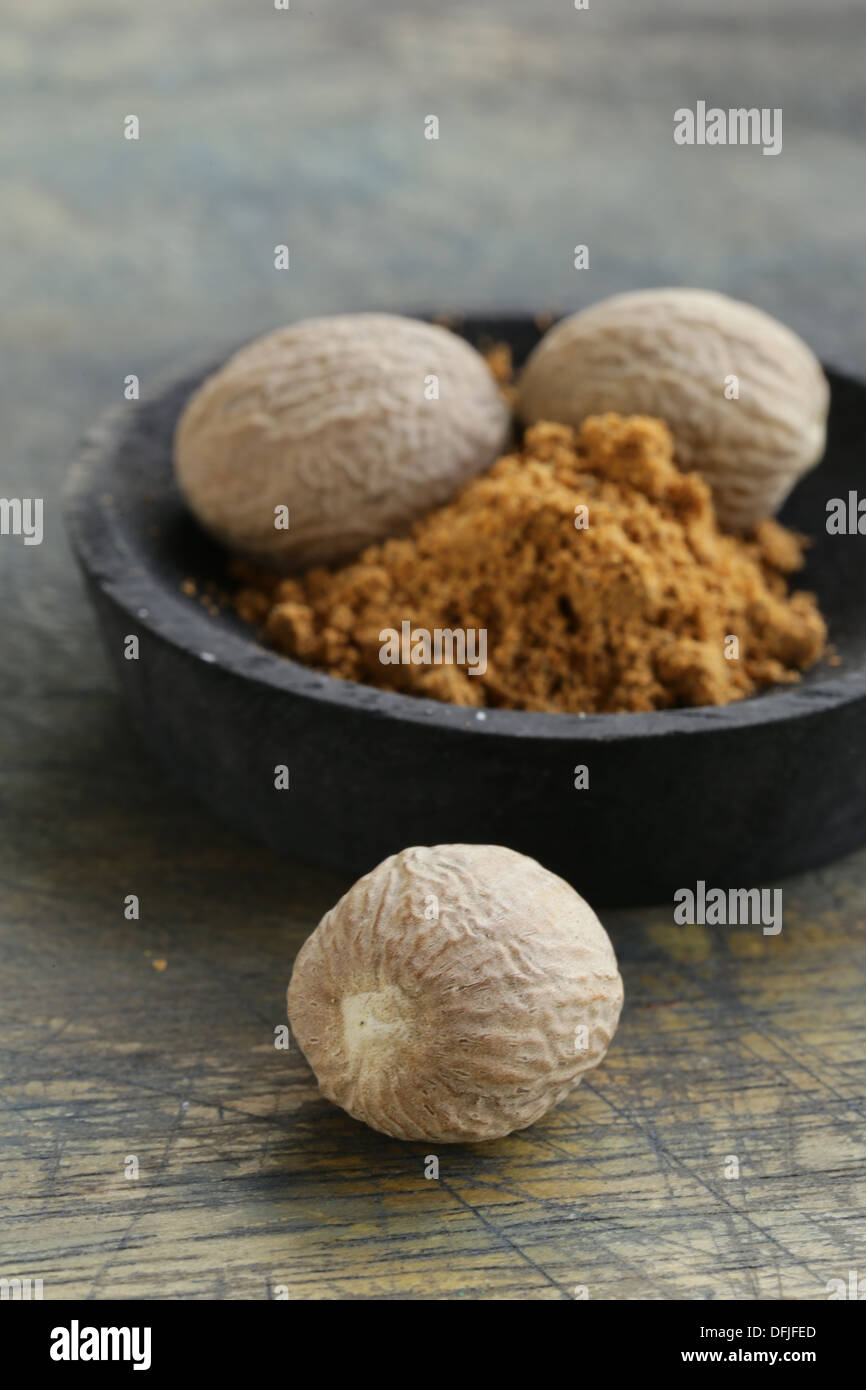 Whole ground nutmeg fragrant spice hires stock photography and images