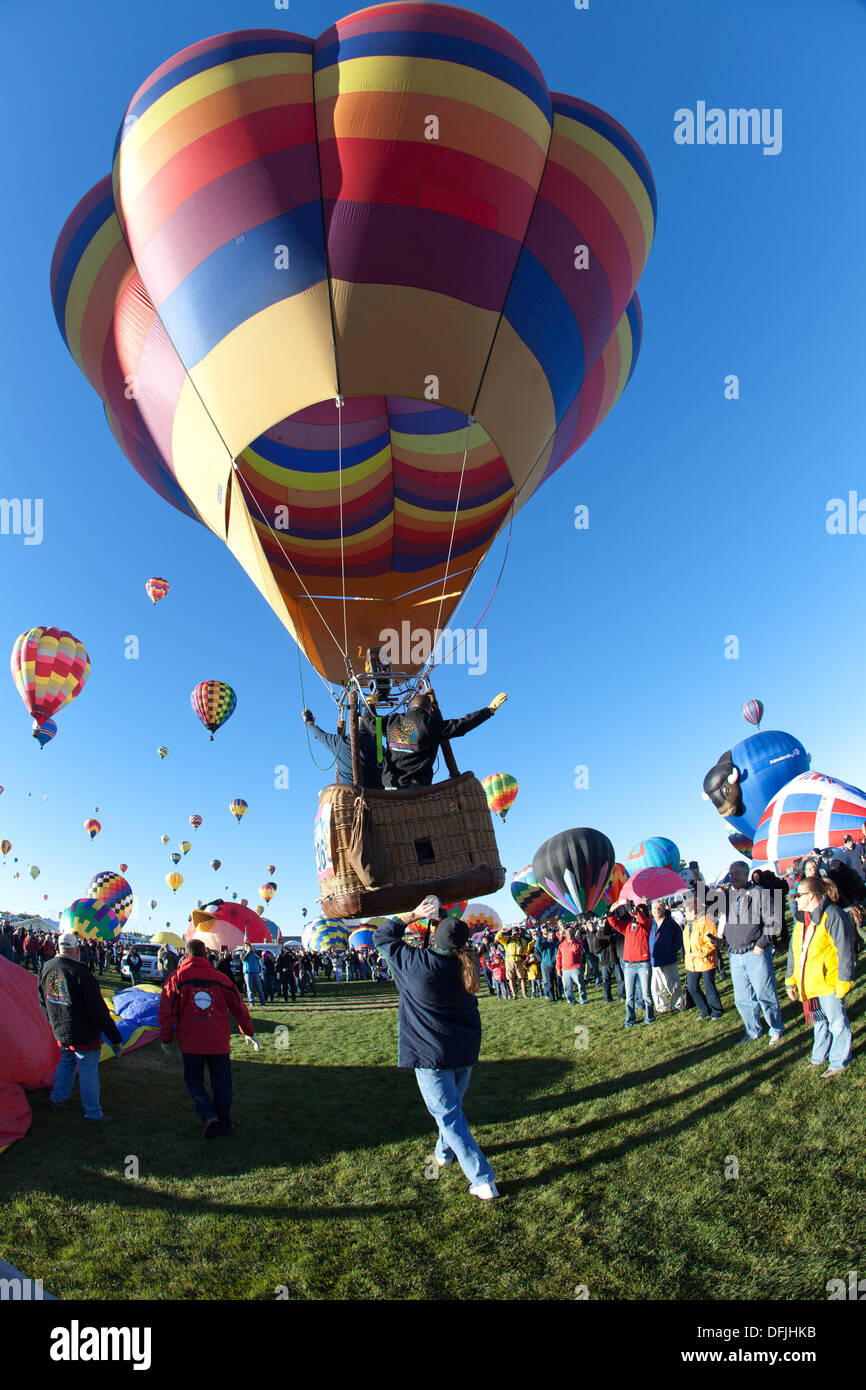 Albuquerque, NM, USA. 5th Oct, 2013. . Balloonists wave goodbye as it ascends, First day of mass ascension at Albuquerque International Balloon Fiesta on Saturday October 5, 2013. Albuquerque, New Mexico, USA. Credit:  Christina Kennedy/Alamy Live News Stock Photo
