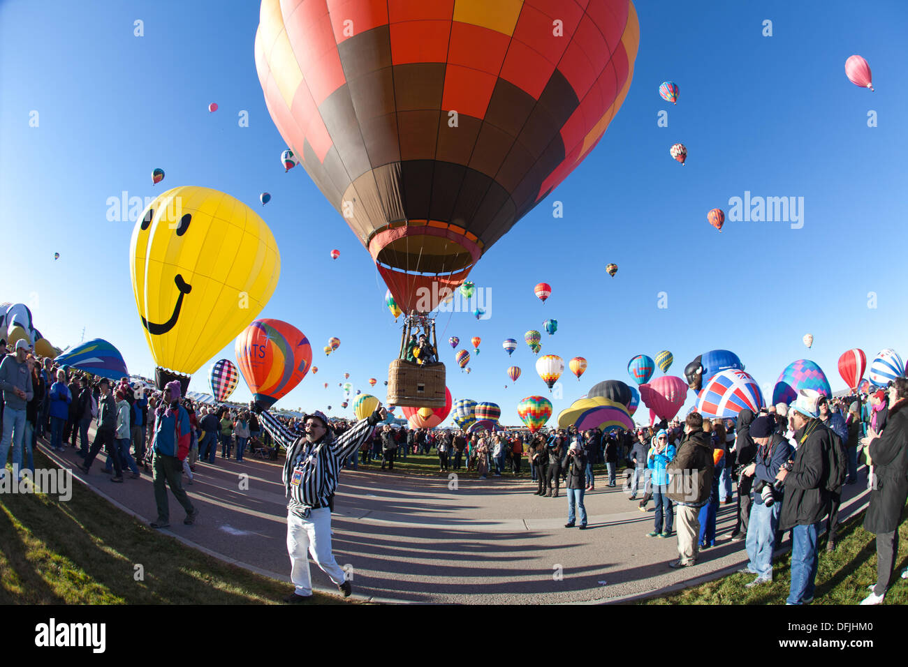 Albuquerque, NM, USA. 5th Oct, 2013. . Balloon Fiesta official waves arms and gives the go-ahead for take off, First day of mass ascension at Albuquerque International Balloon Fiesta on Saturday October 5, 2013. Albuquerque, New Mexico, USA. Credit:  Christina Kennedy/Alamy Live News Stock Photo