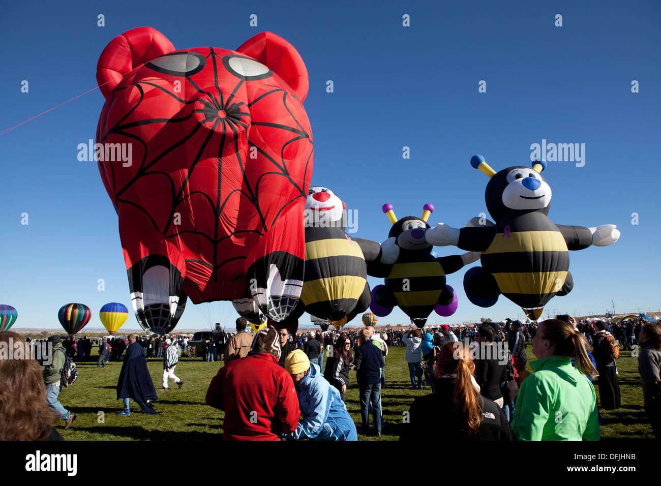 Albuquerque, NM, USA. 5th Oct, 2013. . Spider Pig hot air balloon and bees prepare for flight, The Snow White Balloon waves as she prepares for flight, First day of mass ascension at Albuquerque International Balloon Fiesta on Saturday October 5, 2013. Albuquerque, New Mexico, USA. Credit:  Christina Kennedy/Alamy Live News Stock Photo