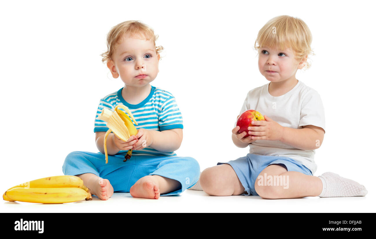 Two kids eating healthy food isolated on white Stock Photo - Alamy