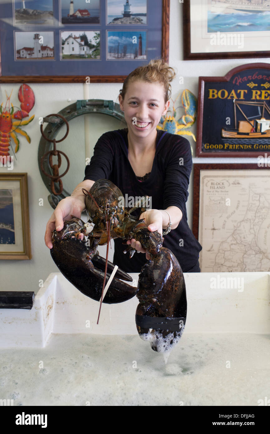 Shelby Smith shows a giant lobster at Sea Well Seafood shack in