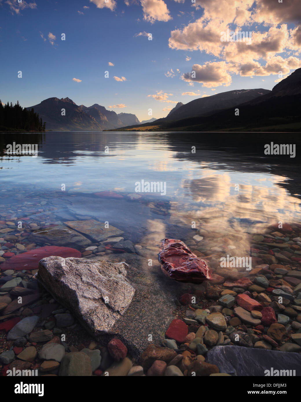 Crystal clear water and clouds over St Mary Lake in Glacier National Park,  Montana Stock Photo - Alamy