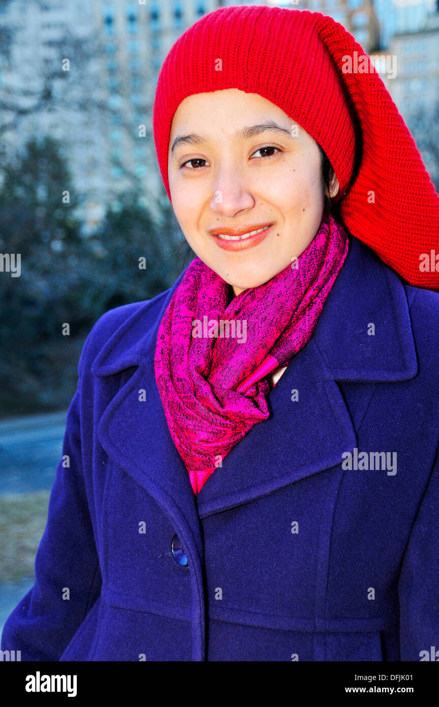 Pretty Latino woman smiling in Central Park, New York City, USA Stock Photo