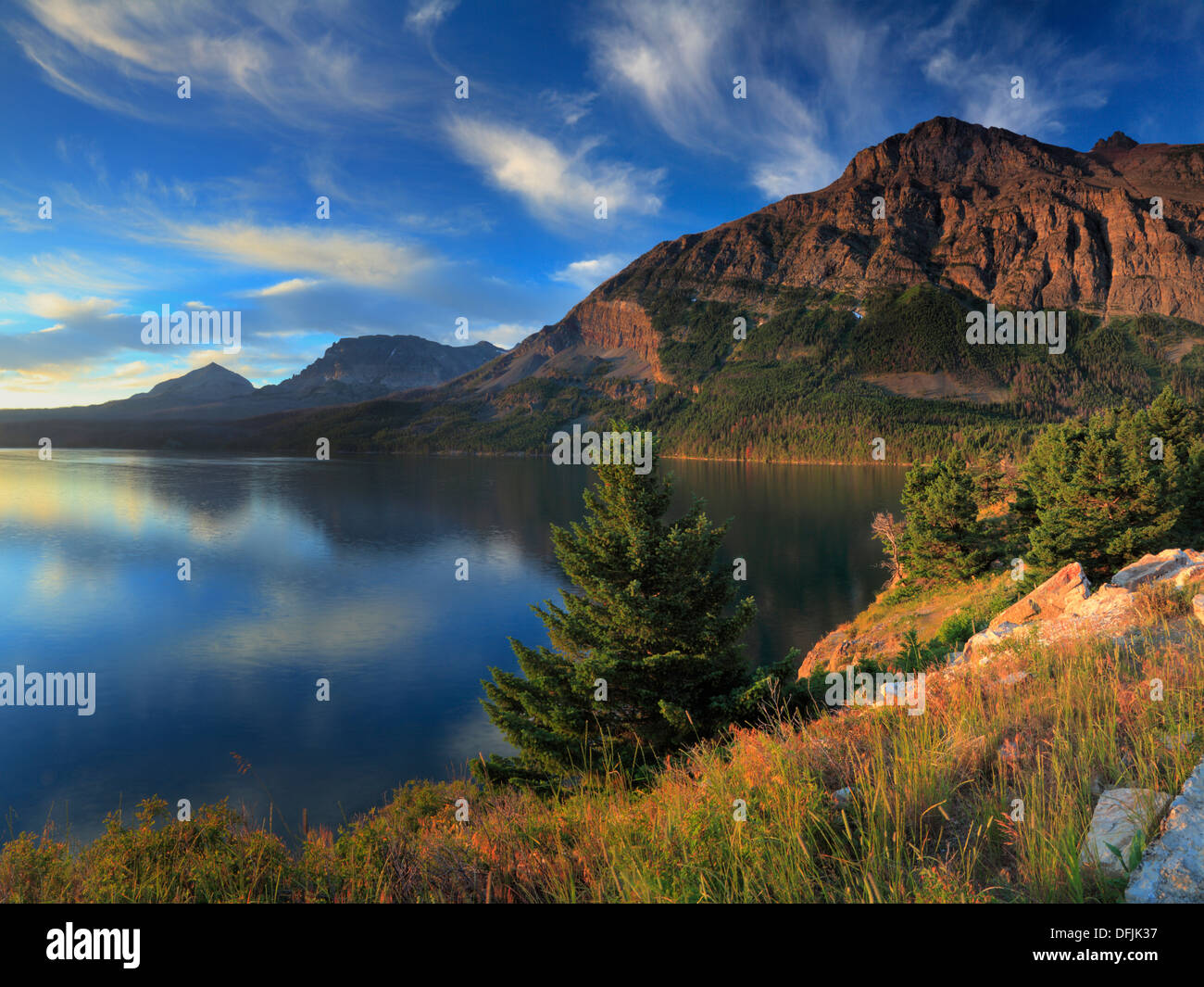 Sunrise Over Saint Mary Lake In Glacier National Park In Montana Stock sunrise-over-saint-mary-lake-in-glacier-national-park-in-montana-stock